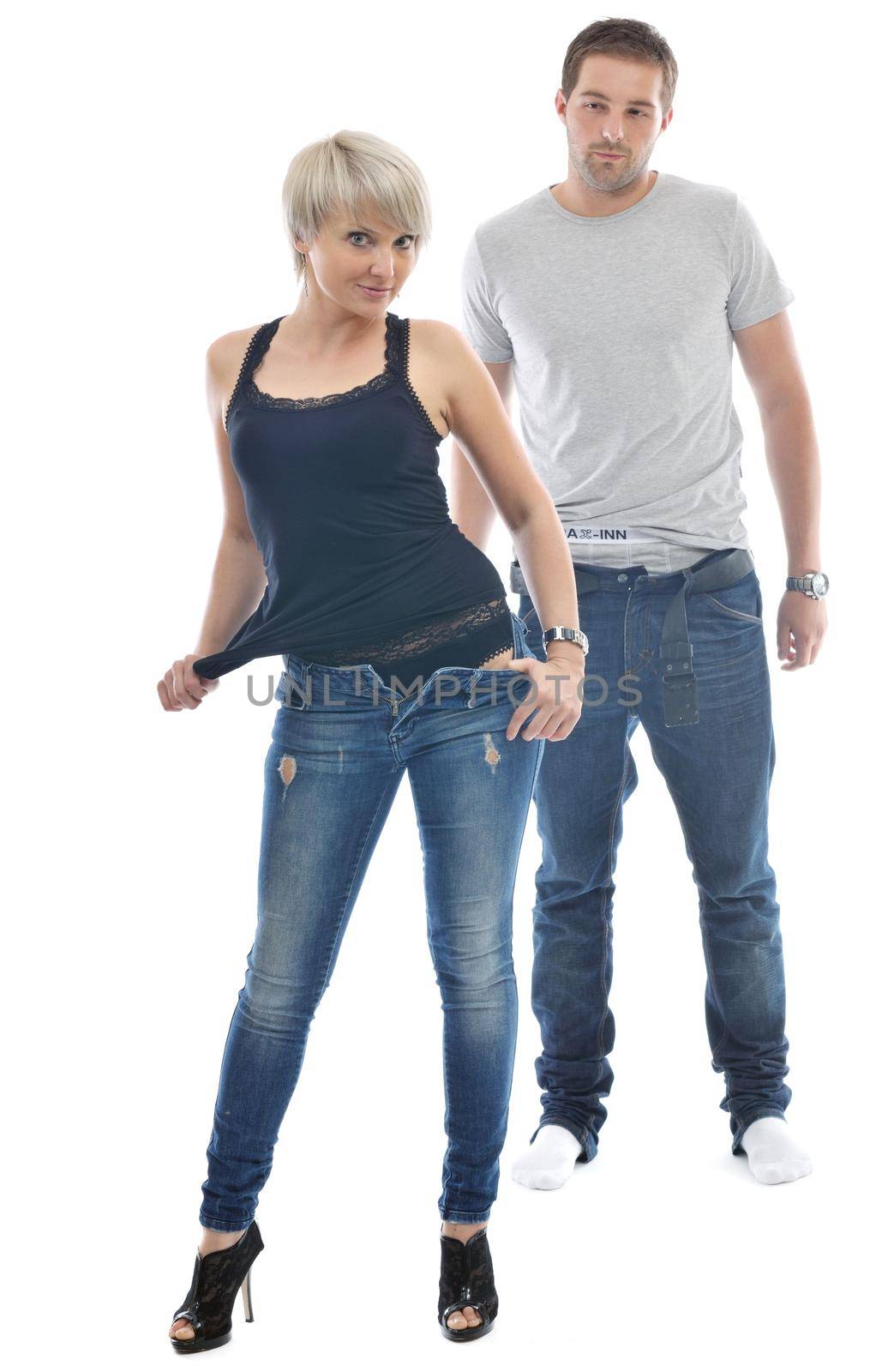 young couple isolated on white in fashionable underwear and blue jeans clothing