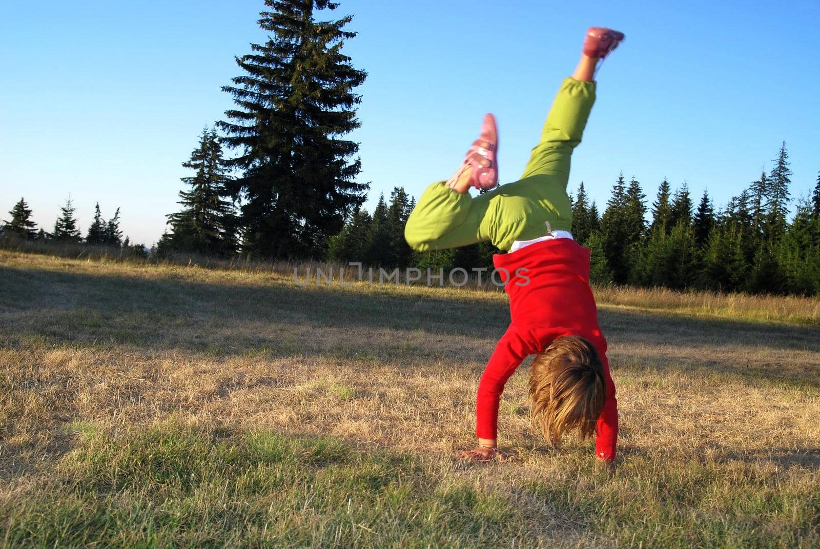 Girl doing exercise in nature