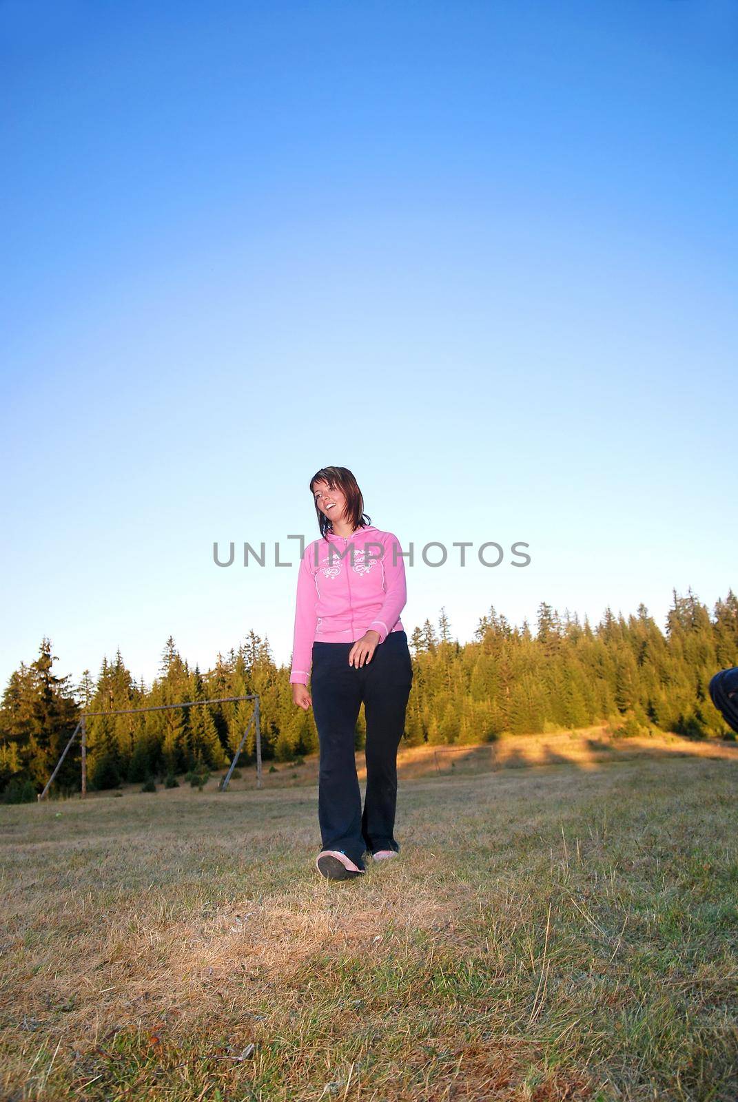 young woman working out in nature