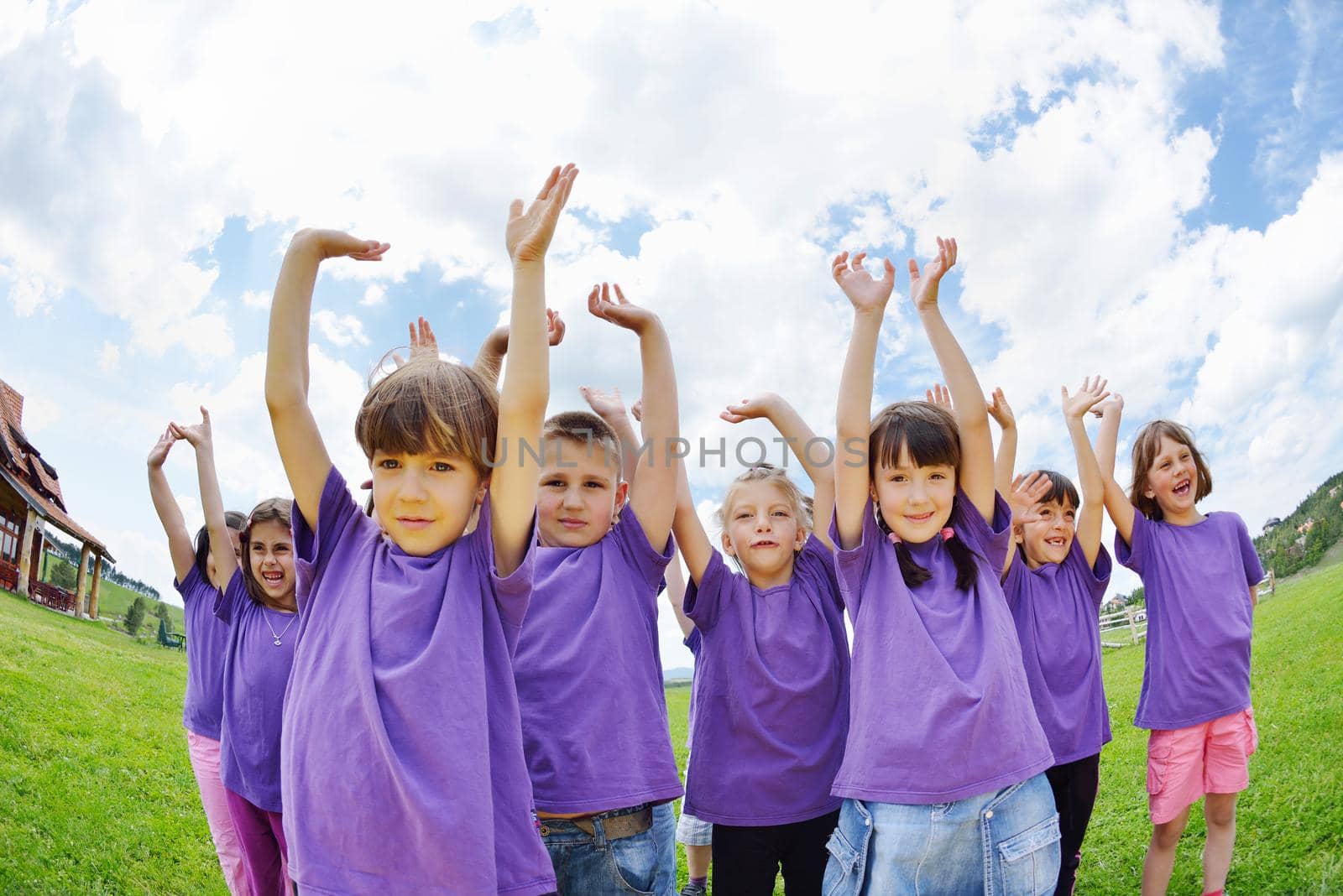 happy kids group have fun in nature outdoors park