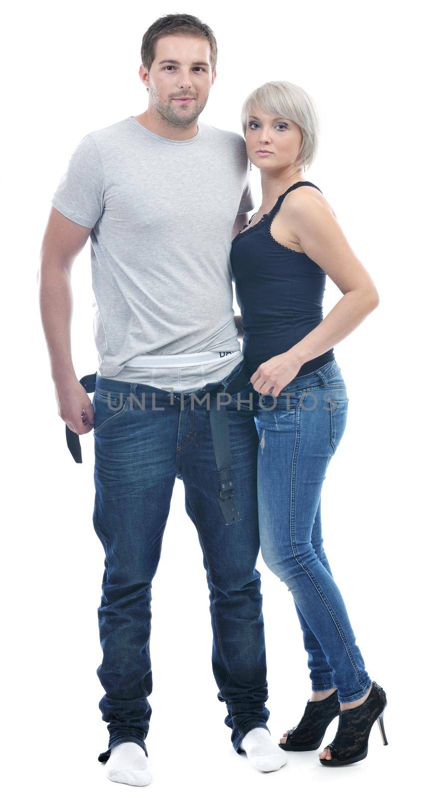 young couple isolated on white in fashionable underwear and blue jeans clothing