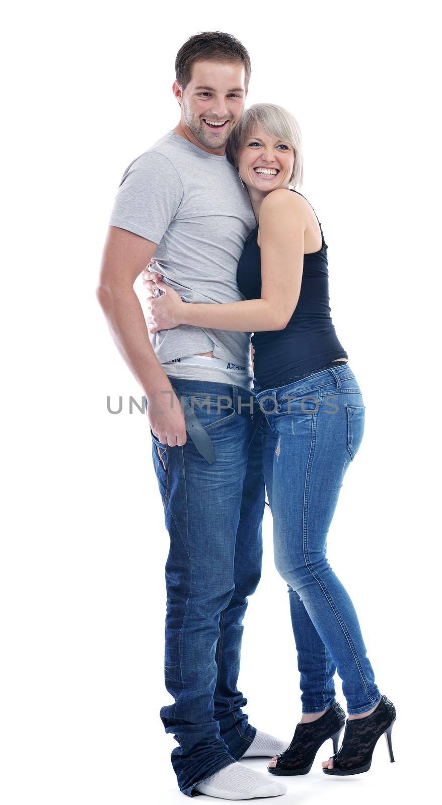 young couple isolated on white in fashionable underwear and blue jeans clothing