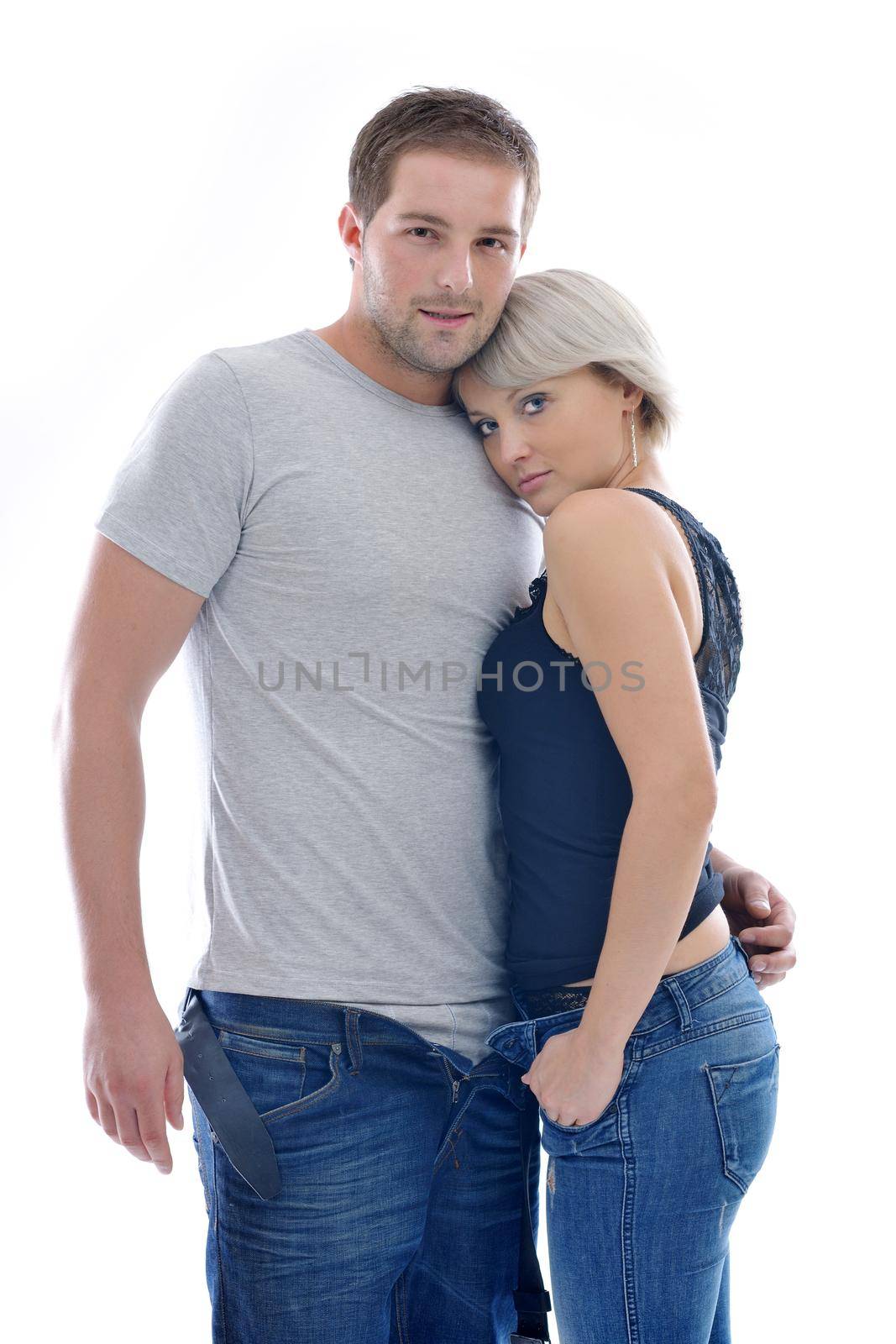 young couple isolated on white in fashionable underwear and blue jeans clothing