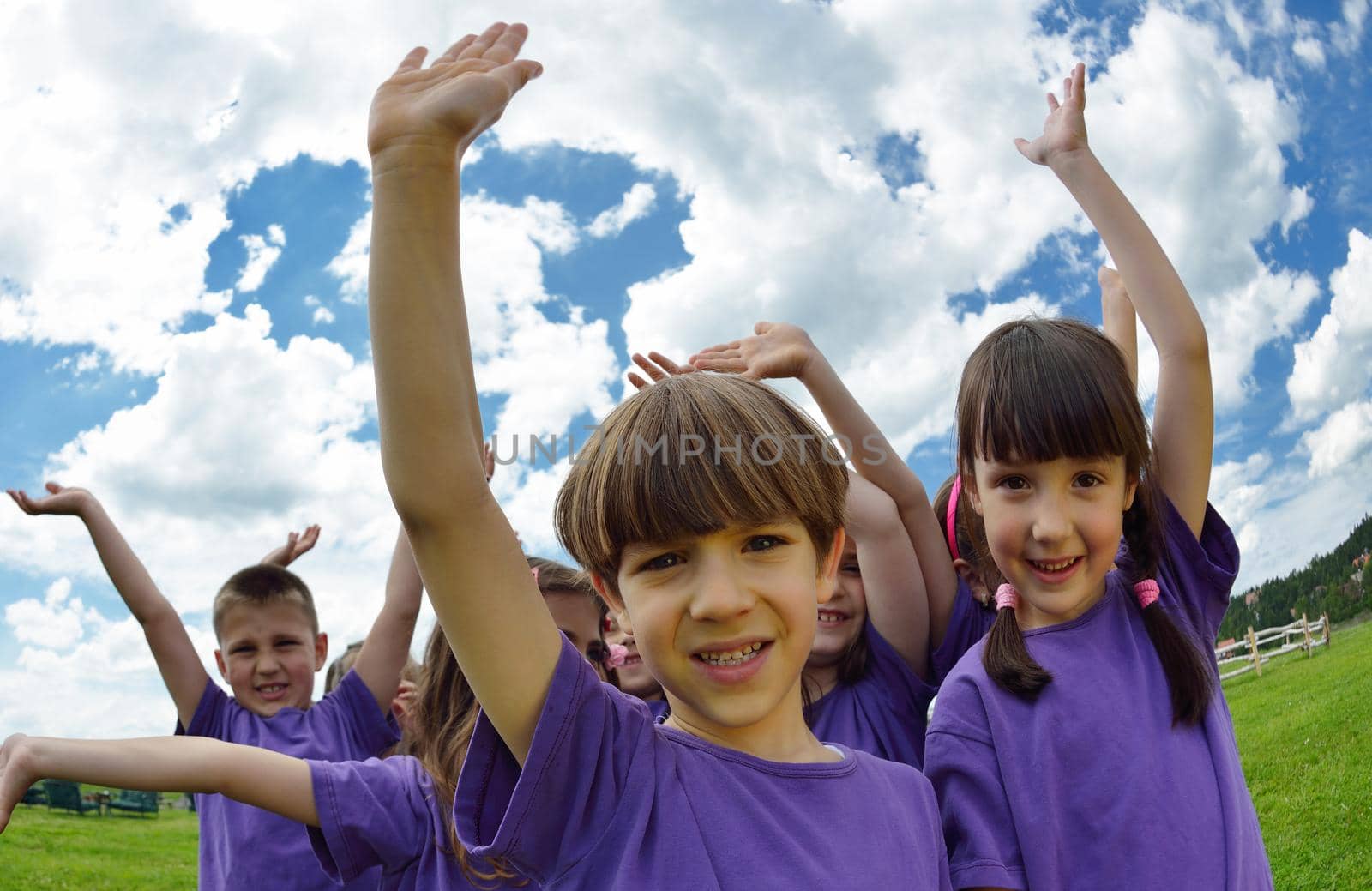 happy kids group have fun in nature outdoors park