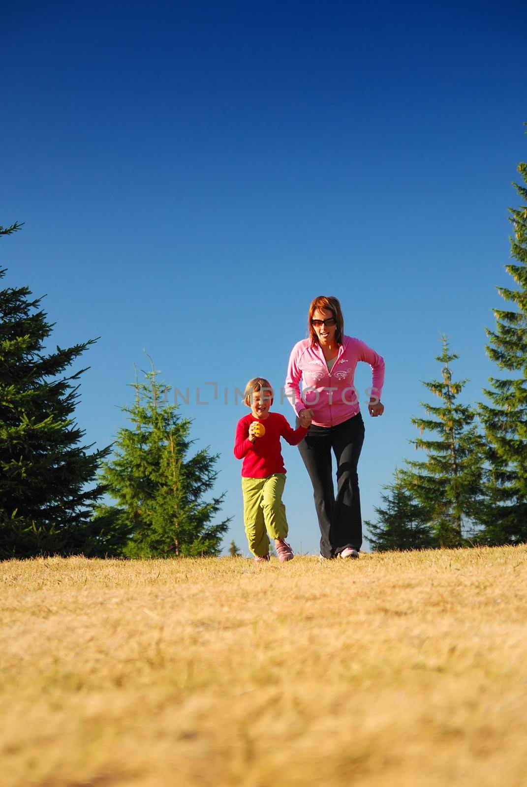 young mother and doughter recreating in nature