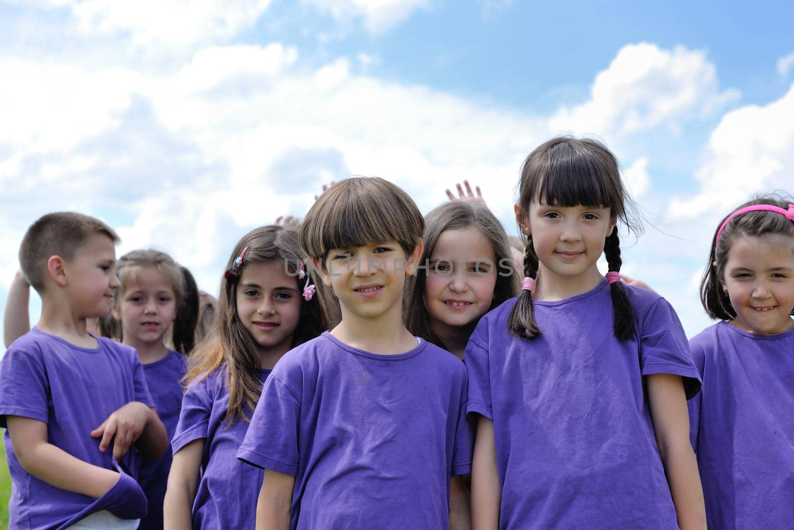 happy kids group have fun in nature outdoors park