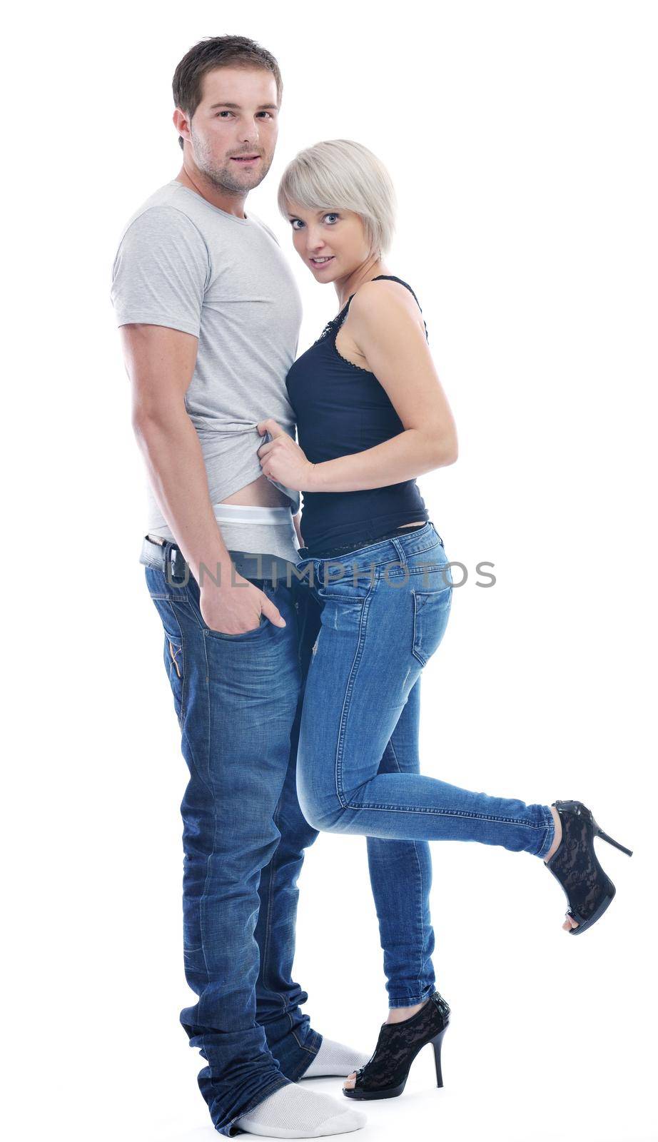 young couple isolated on white in fashionable underwear and blue jeans clothing