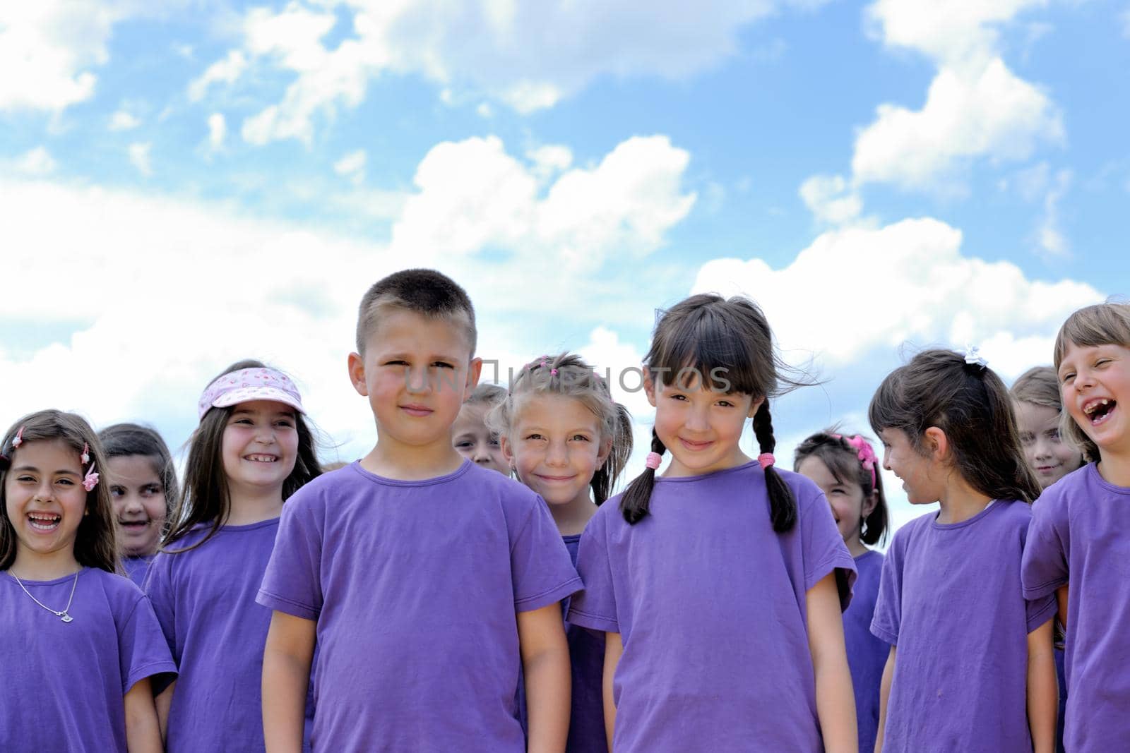 happy kids group have fun in nature outdoors park