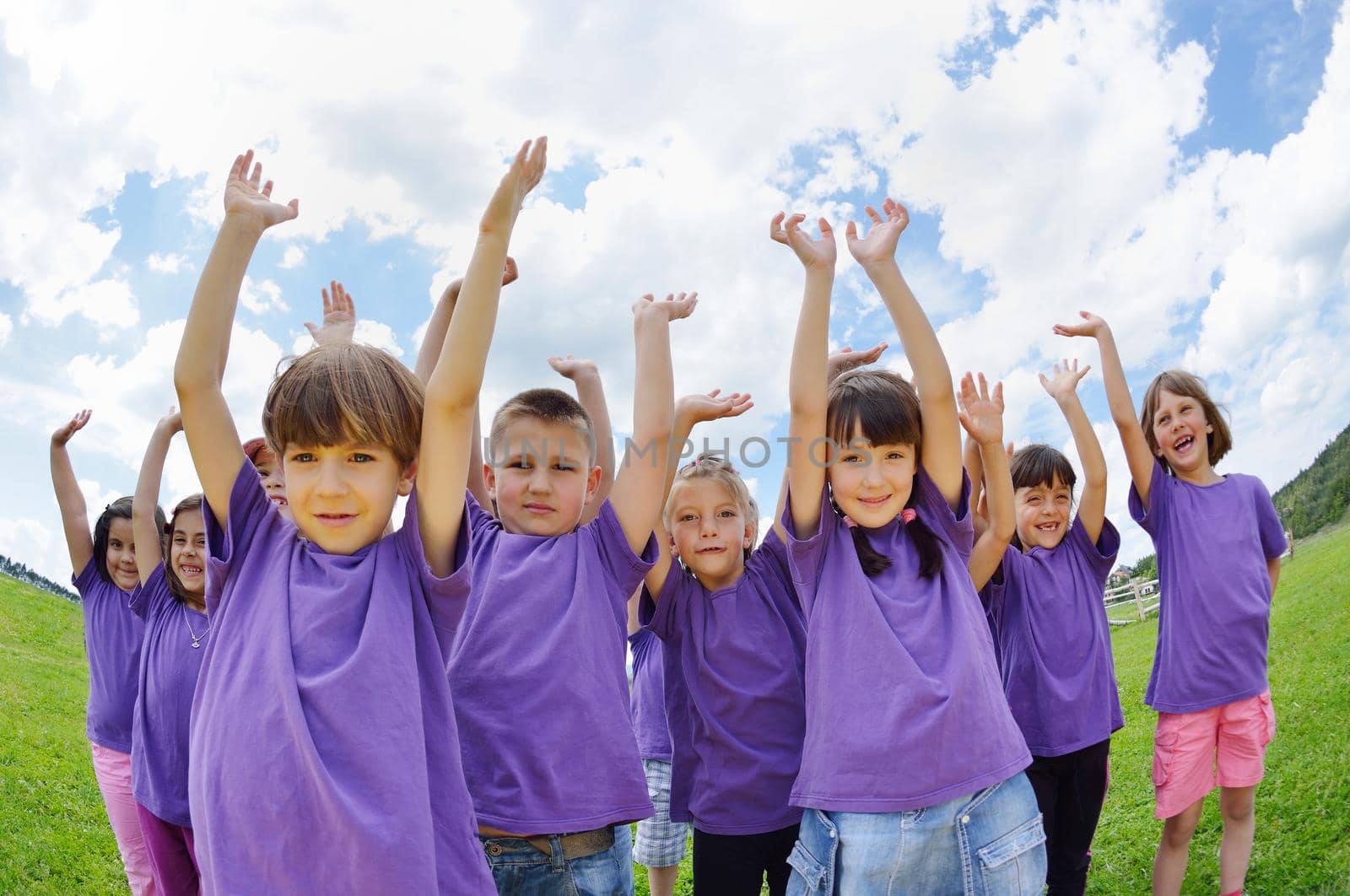 happy kids group have fun in nature outdoors park