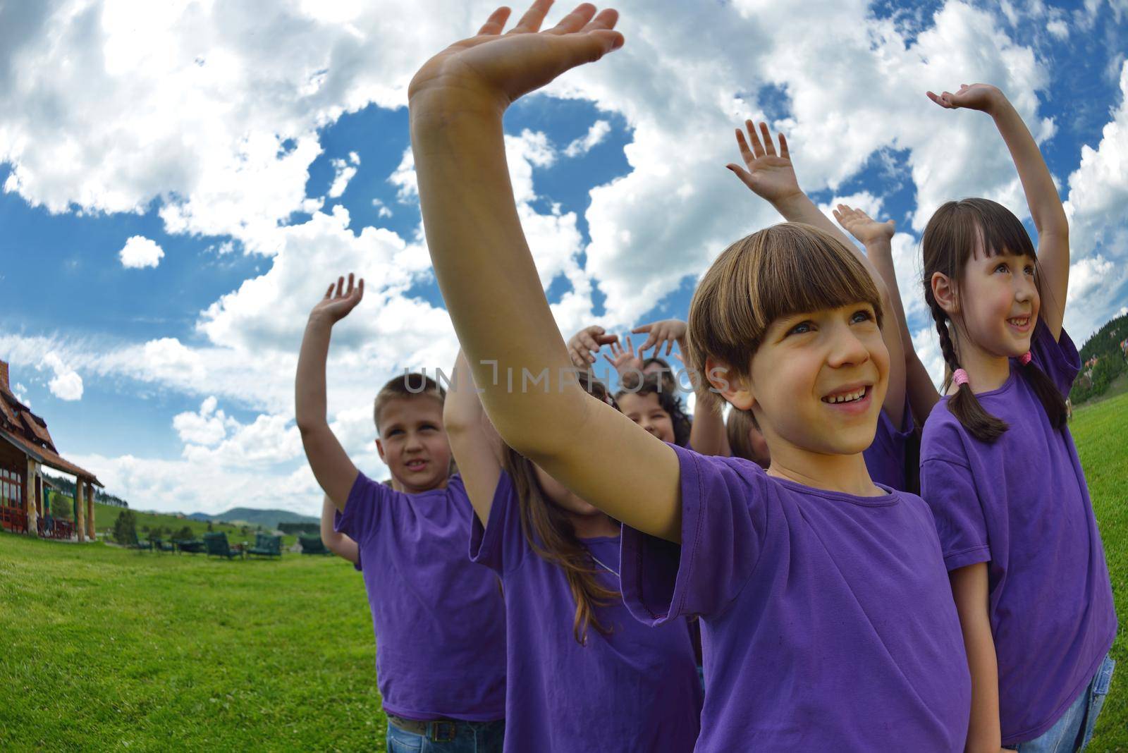 happy kids group have fun in nature outdoors park