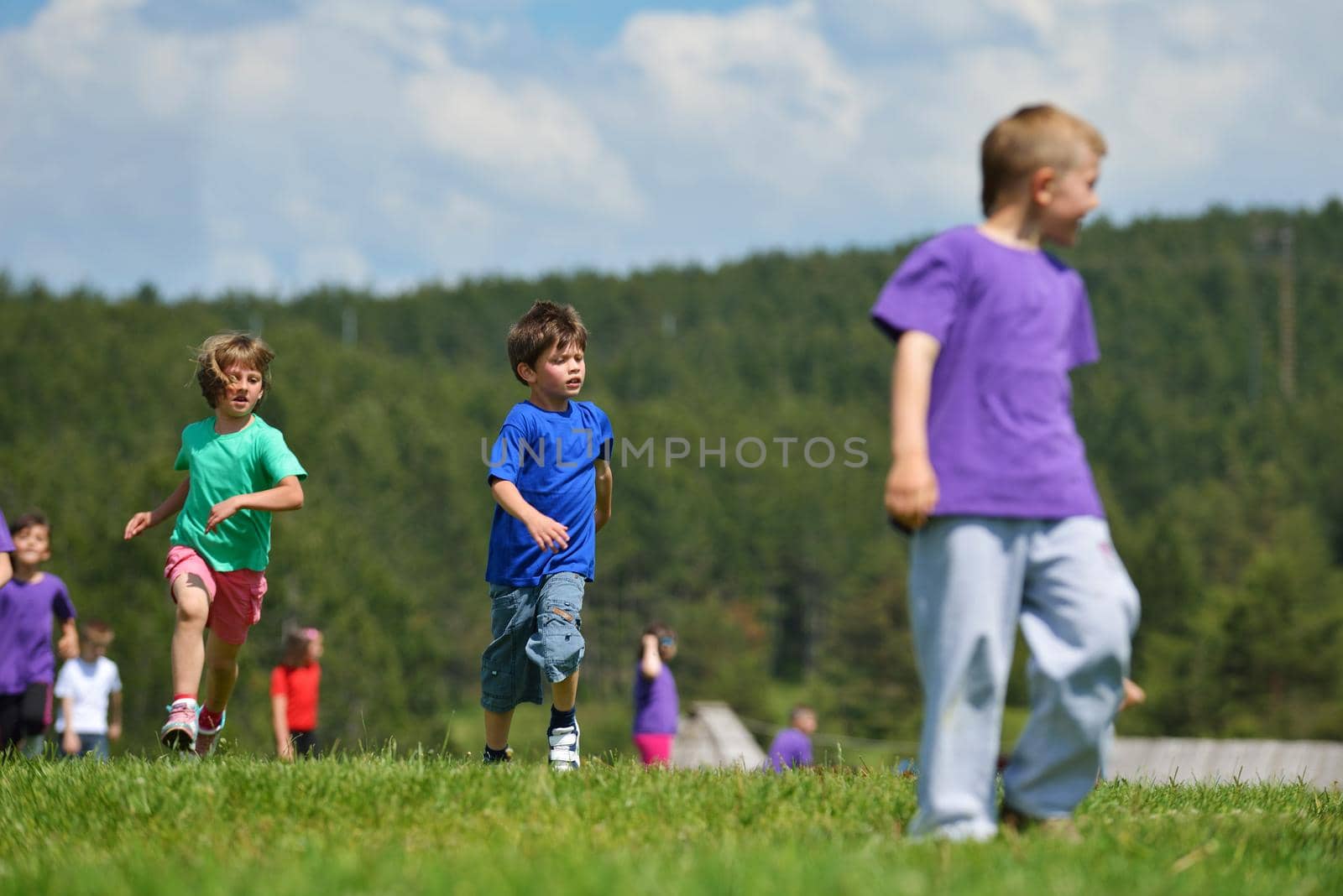 happy kids group  have fun in nature by dotshock