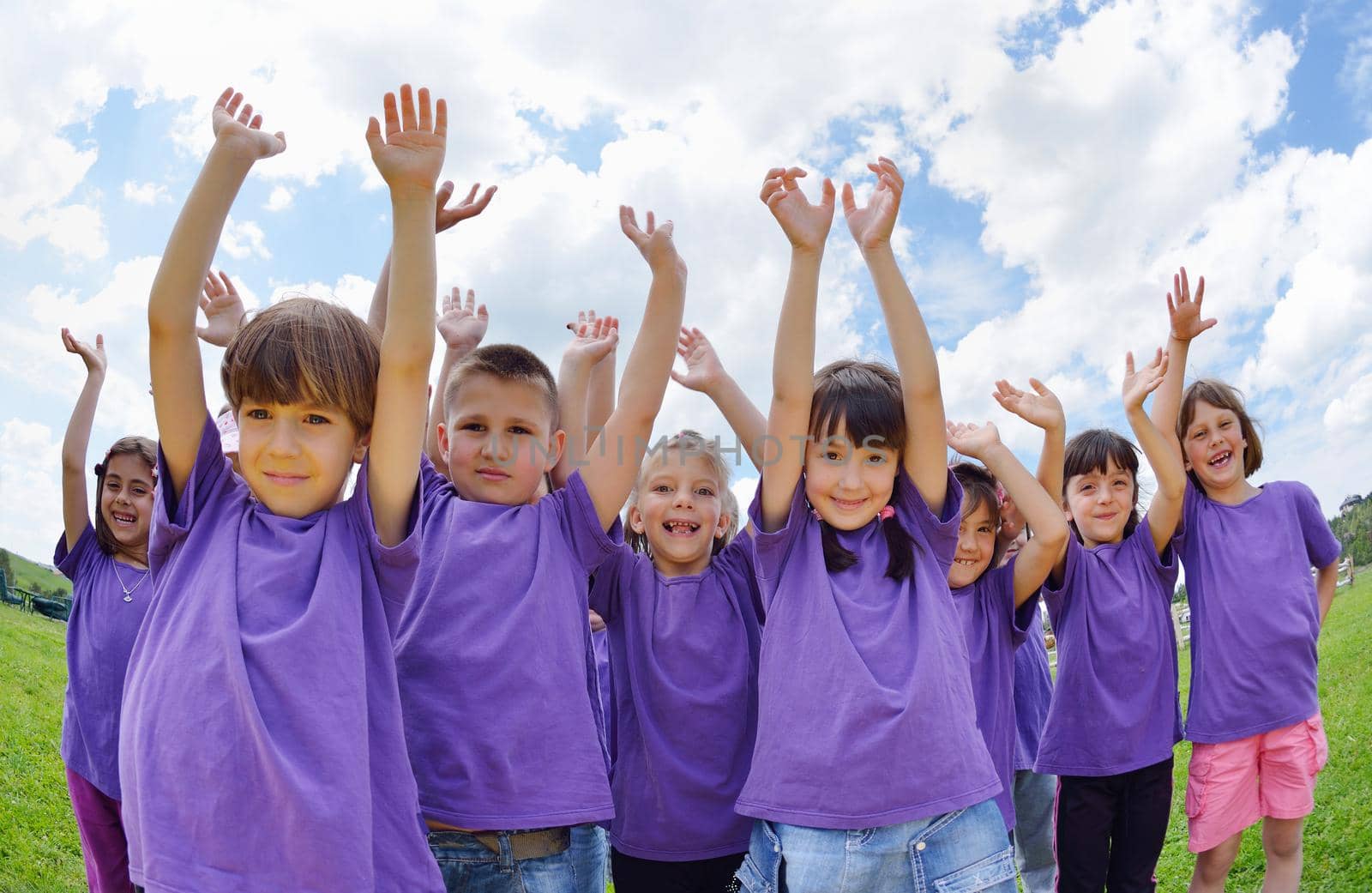 happy kids group have fun in nature outdoors park