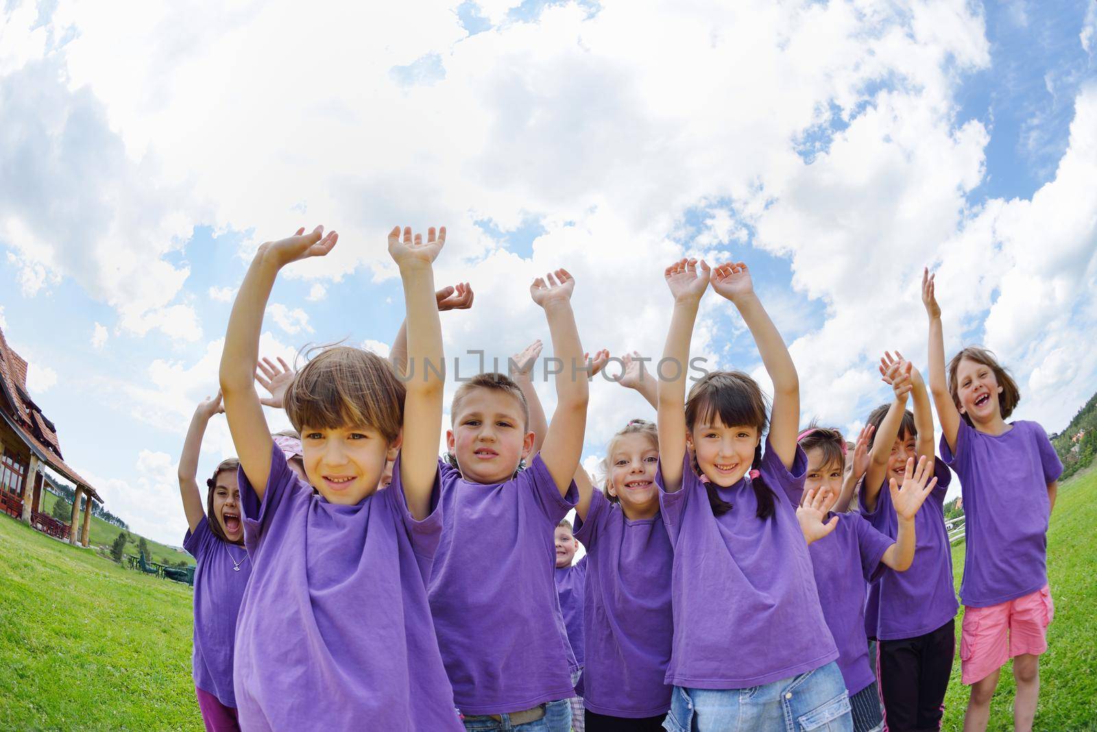 happy kids group have fun in nature outdoors park