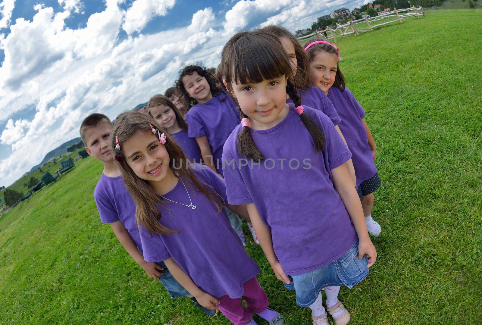 happy kids group have fun in nature outdoors park