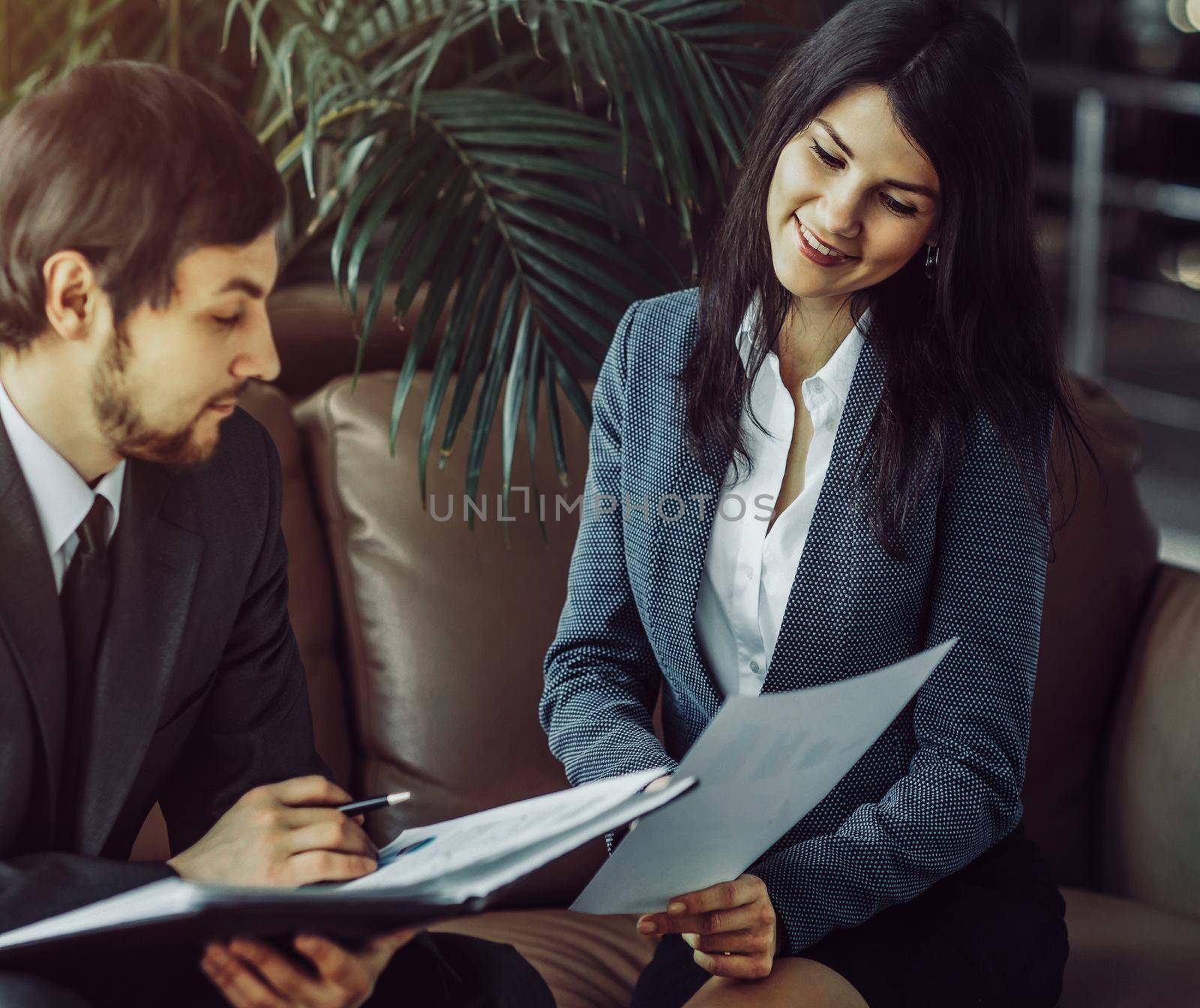 Businessman And Businesswoman Meeting In Modern Office