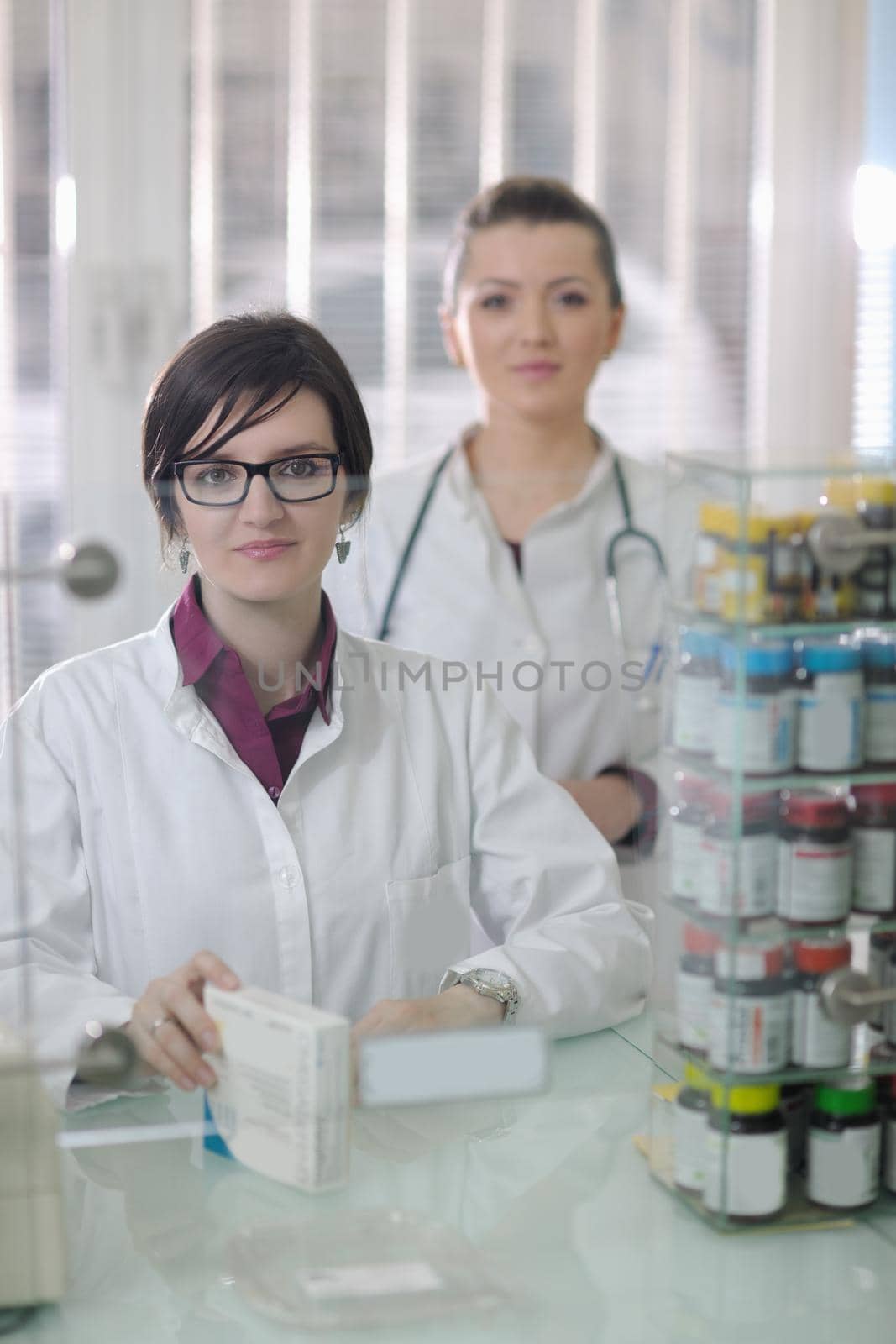 team of pharmacist chemist woman  in pharmacy drugstore by dotshock