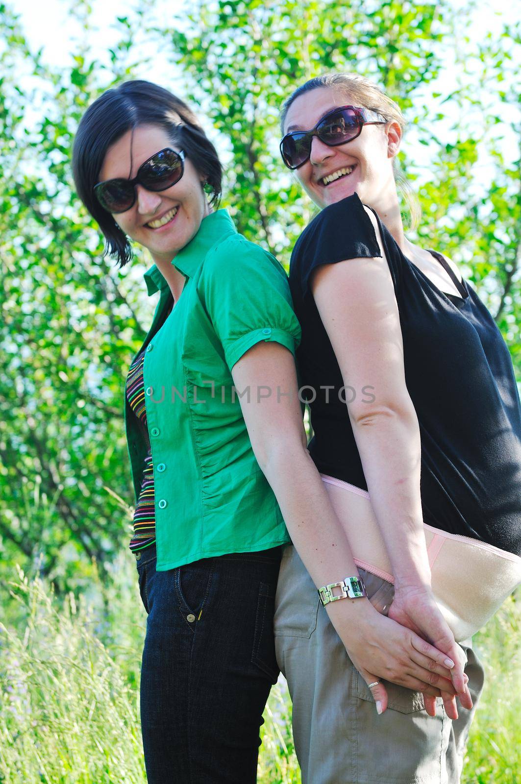 woman pragnant outdoor with friend smile and joy