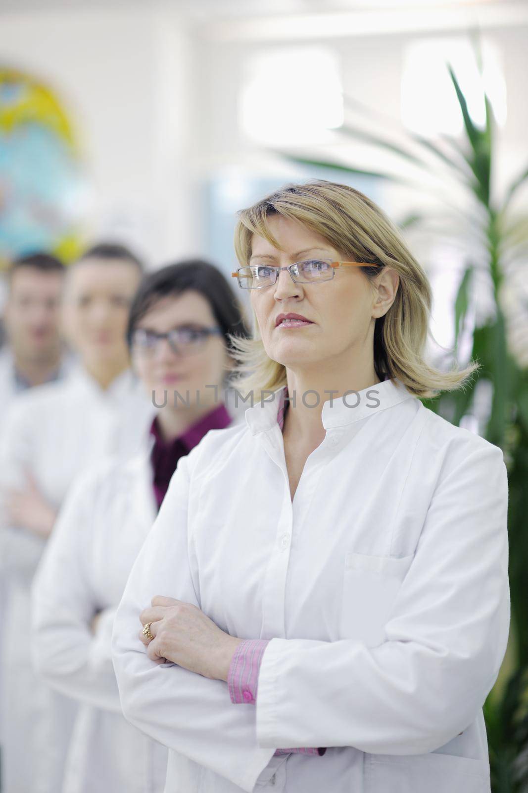 team of  pharmacist chemist woman and man  group  standing in pharmacy drugstore