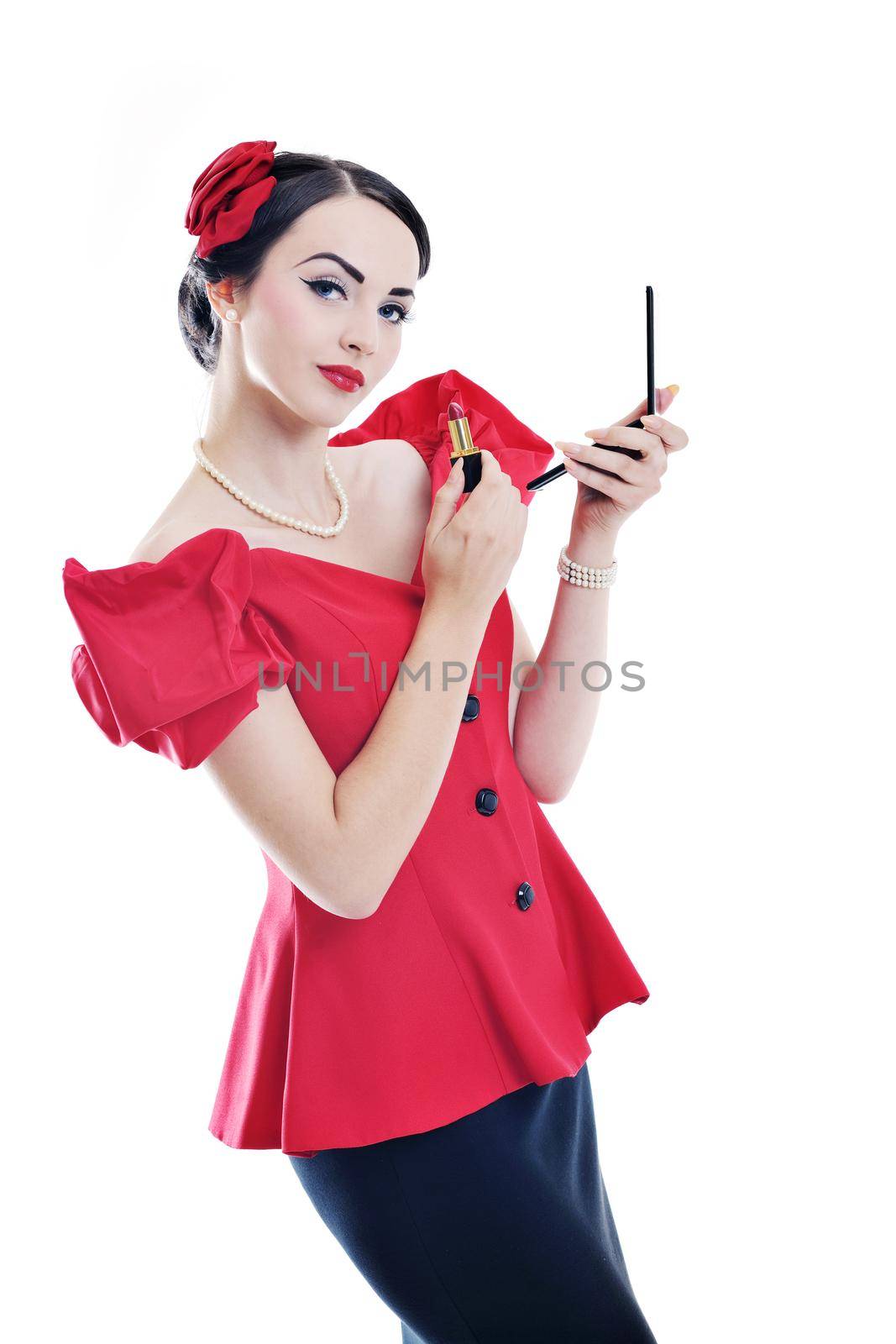 beautiful young pinup  woman apply makeup and cosmetics beauty treatment isolated on white in studio