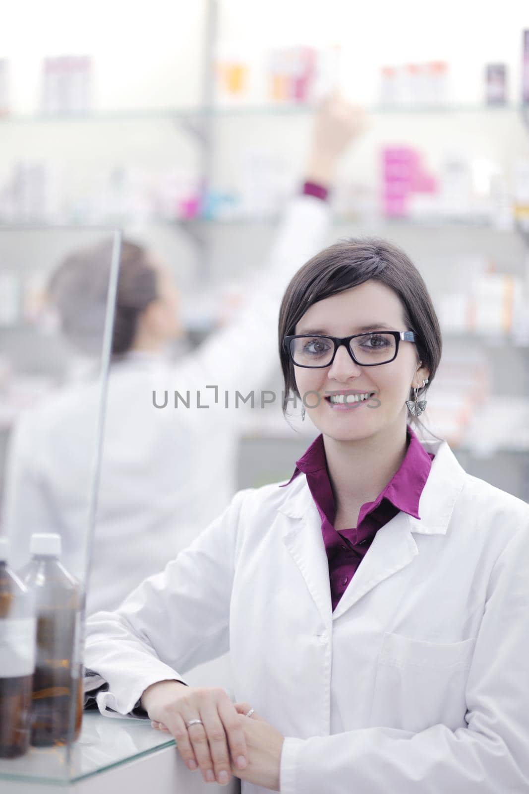 team of pharmacist chemist woman  in pharmacy drugstore by dotshock