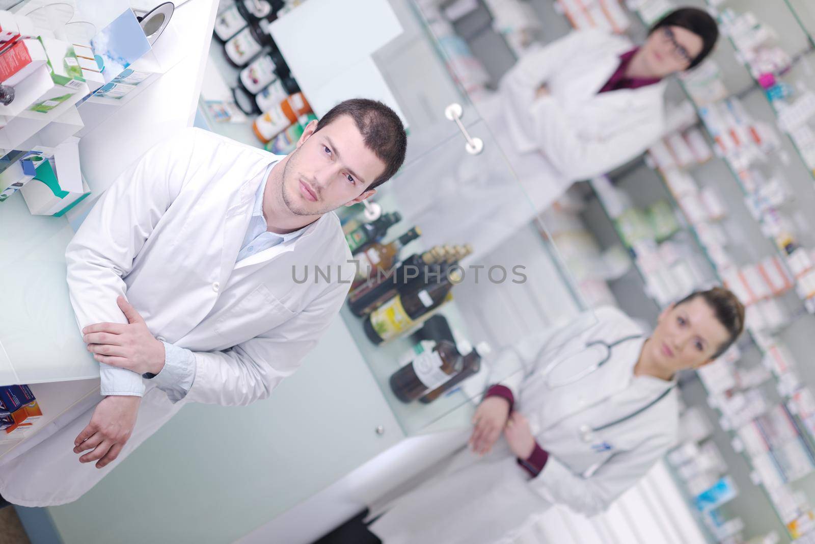 team of  pharmacist chemist woman and man  group  standing in pharmacy drugstore