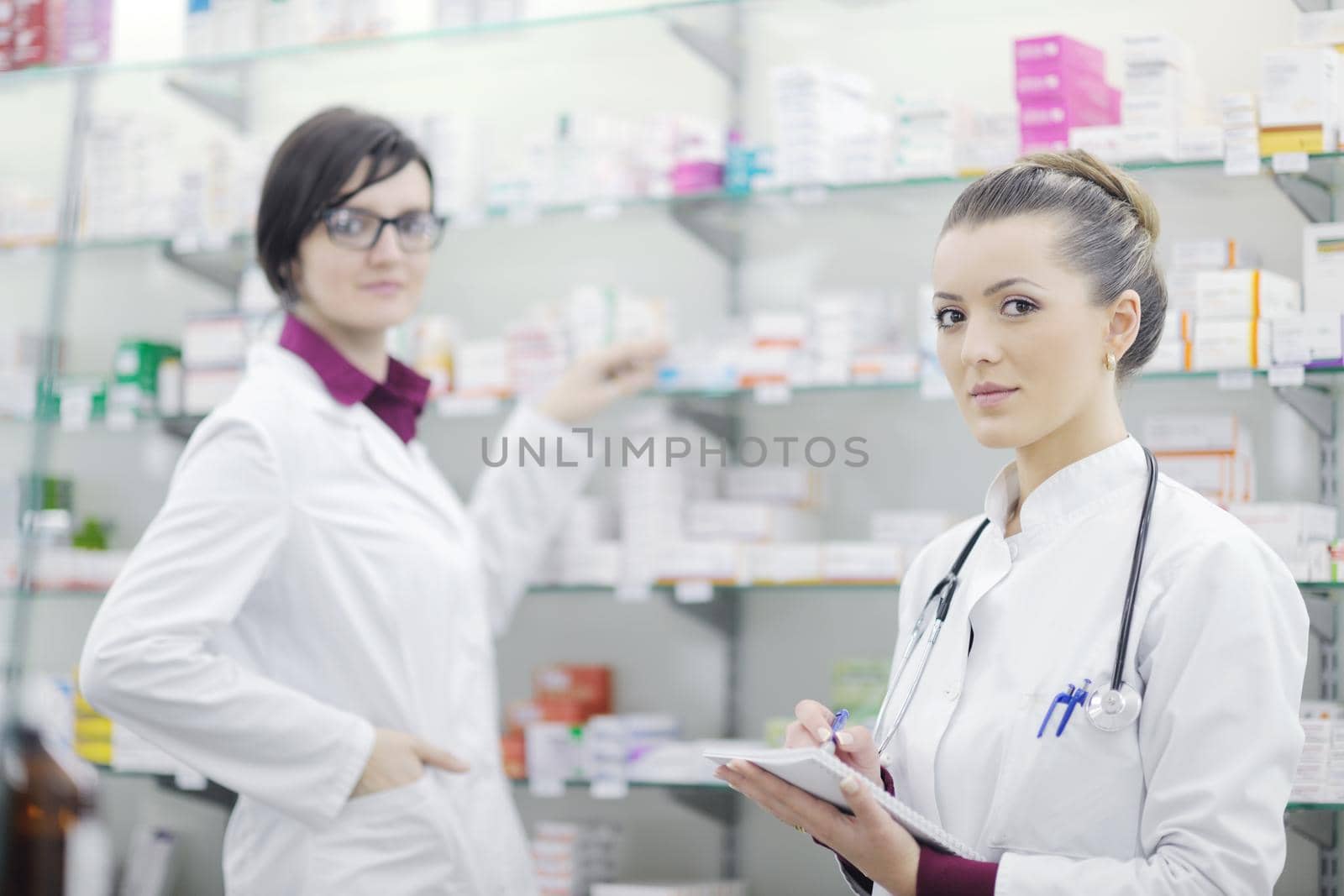 team of  pharmacist chemist woman group  standing in pharmacy drugstore