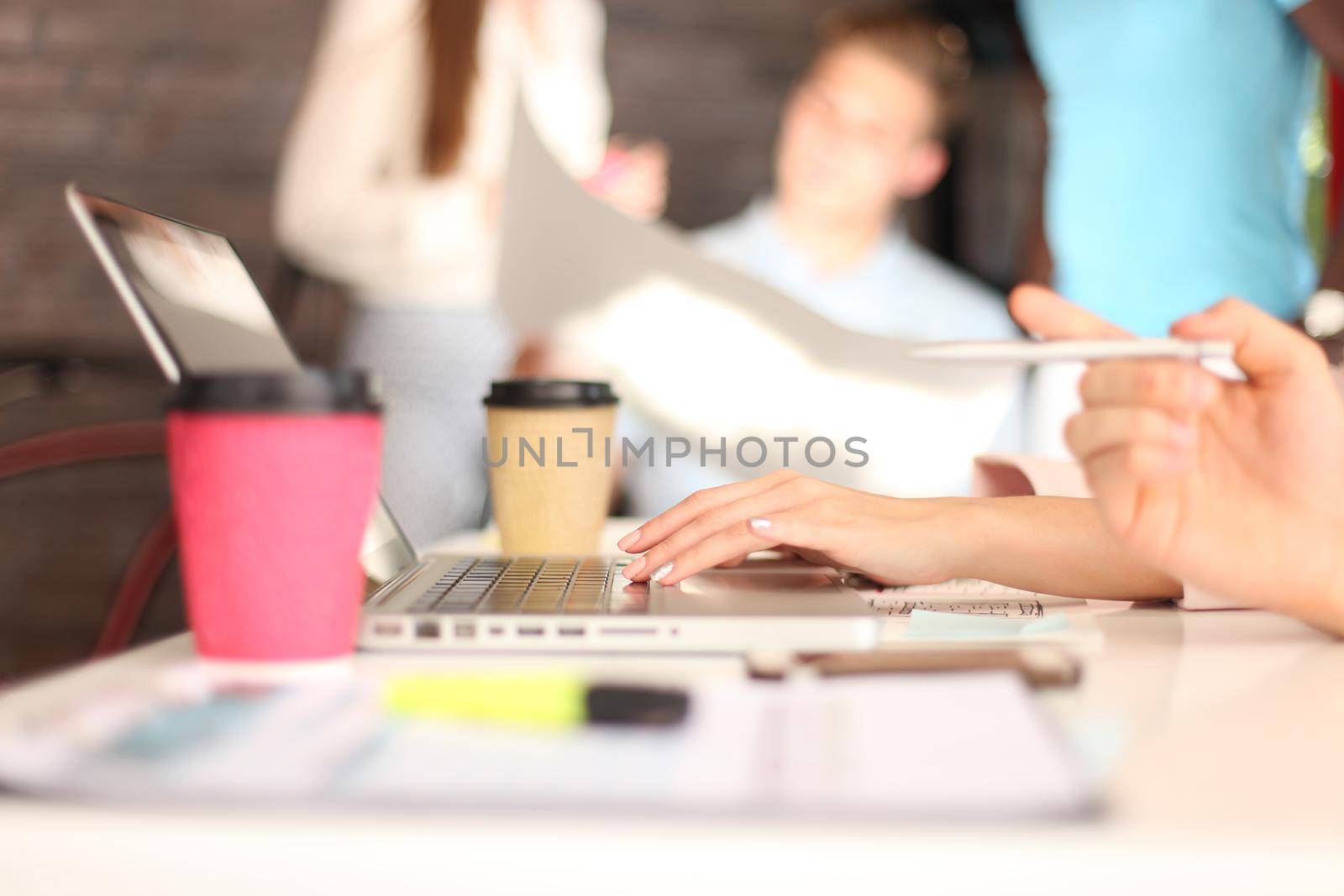 Young group of people doing their jobs on laptop. by tsyhun