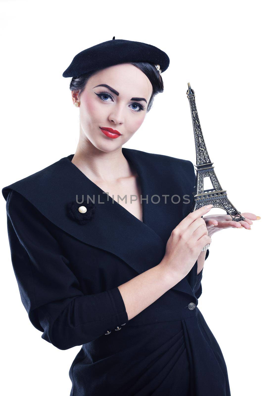 beautiful young woman hold paris symbol eiffel tower isolated on white background and representing travel and tourist concept