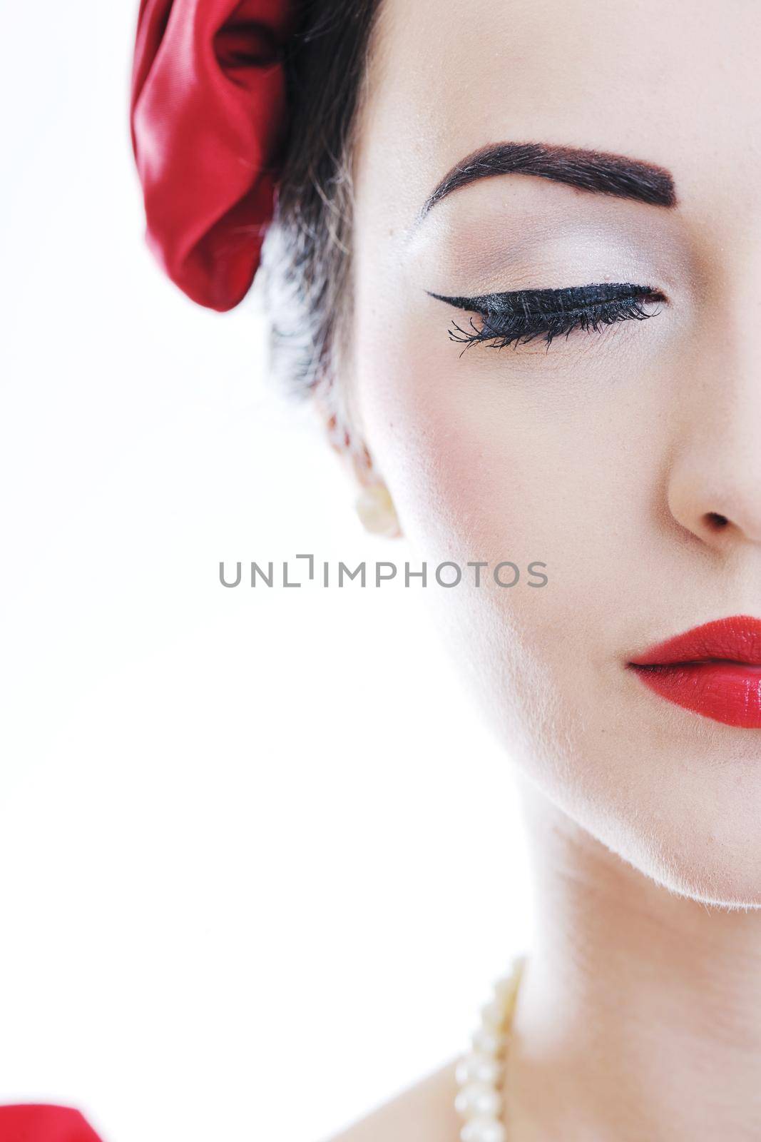 beautiful young woman isolated on white in studio in old fashion clothes representing pinup and retro style