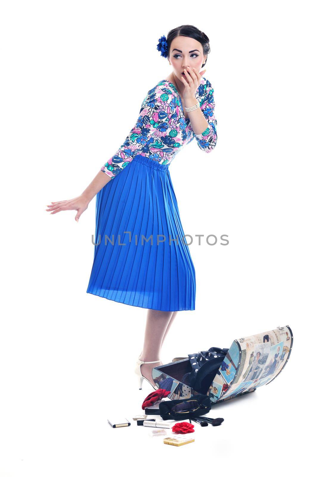 pretty young happy woman with travel bag waiting and posing isolated on white backround  in studio