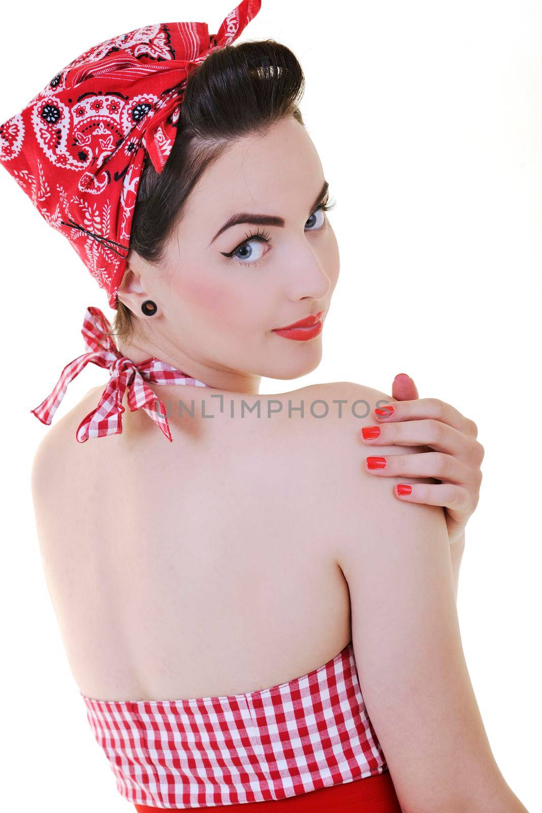 beautiful young woman isolated on white in studio in old fashion clothes representing pinup and retro style