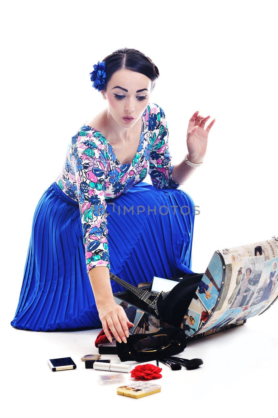 pretty young happy woman with travel bag waiting and posing isolated on white backround  in studio