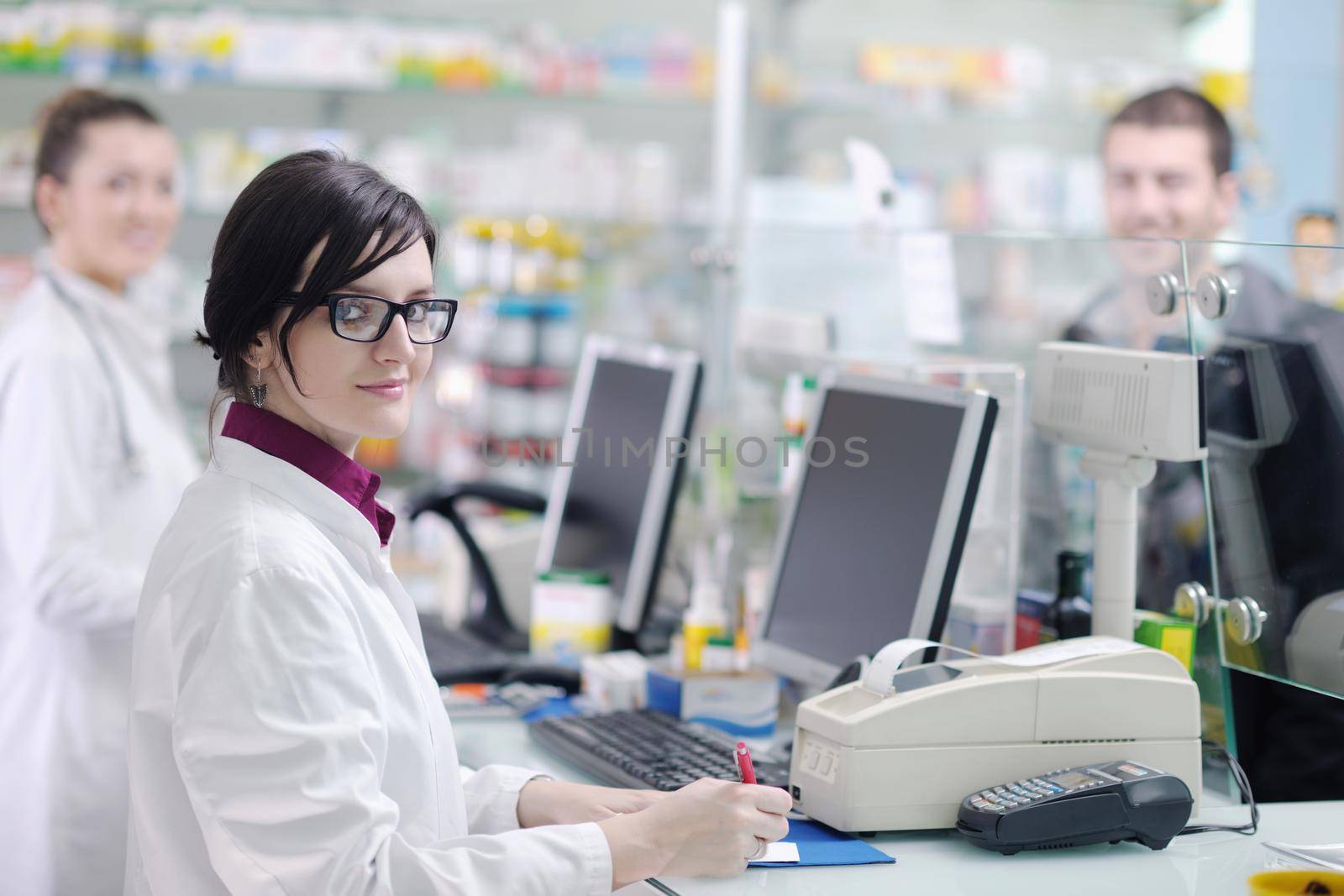 young pharmacist suggesting medical drug to buyer in pharmacy drugstore