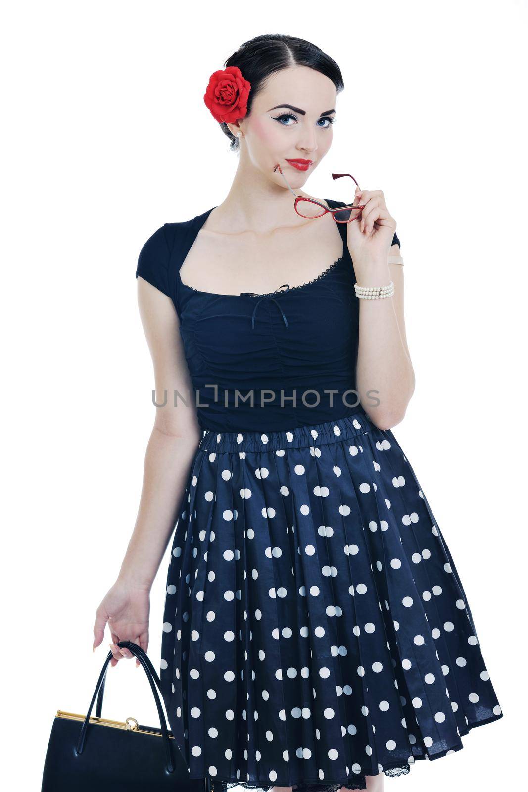 beautiful young woman isolated on white in studio in old fashion clothes representing pinup and retro style