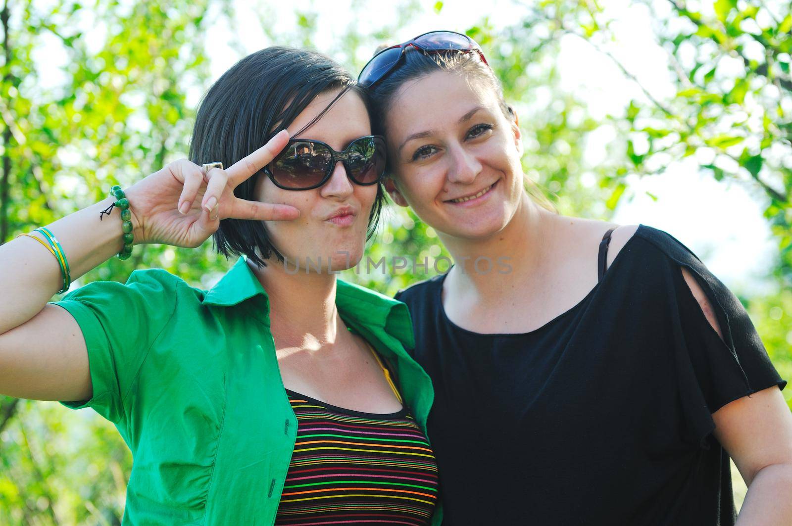 woman pragnant outdoor with friend smile and joy