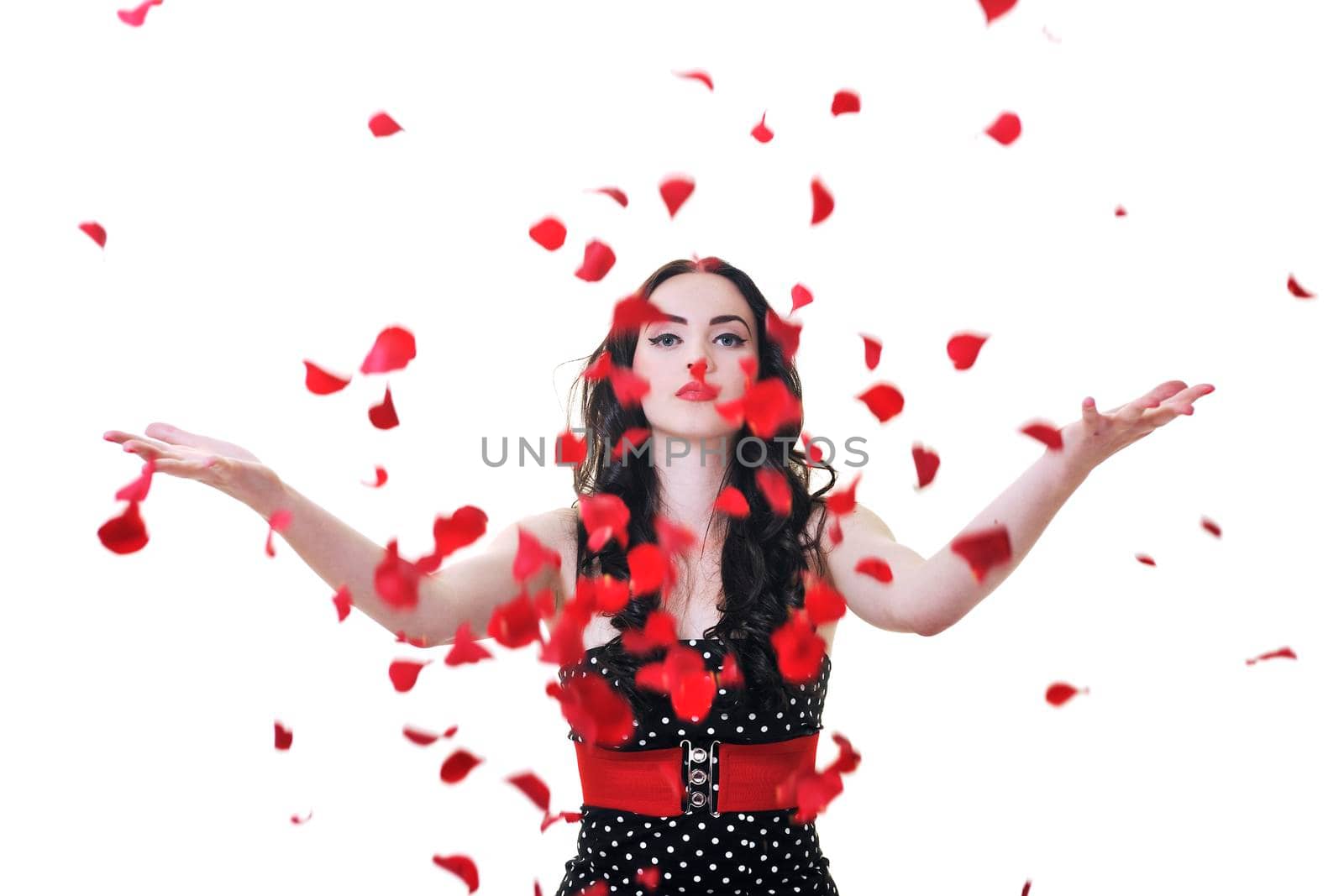 beautiful young woman with rose flower petals isolated on white representing beauty concept