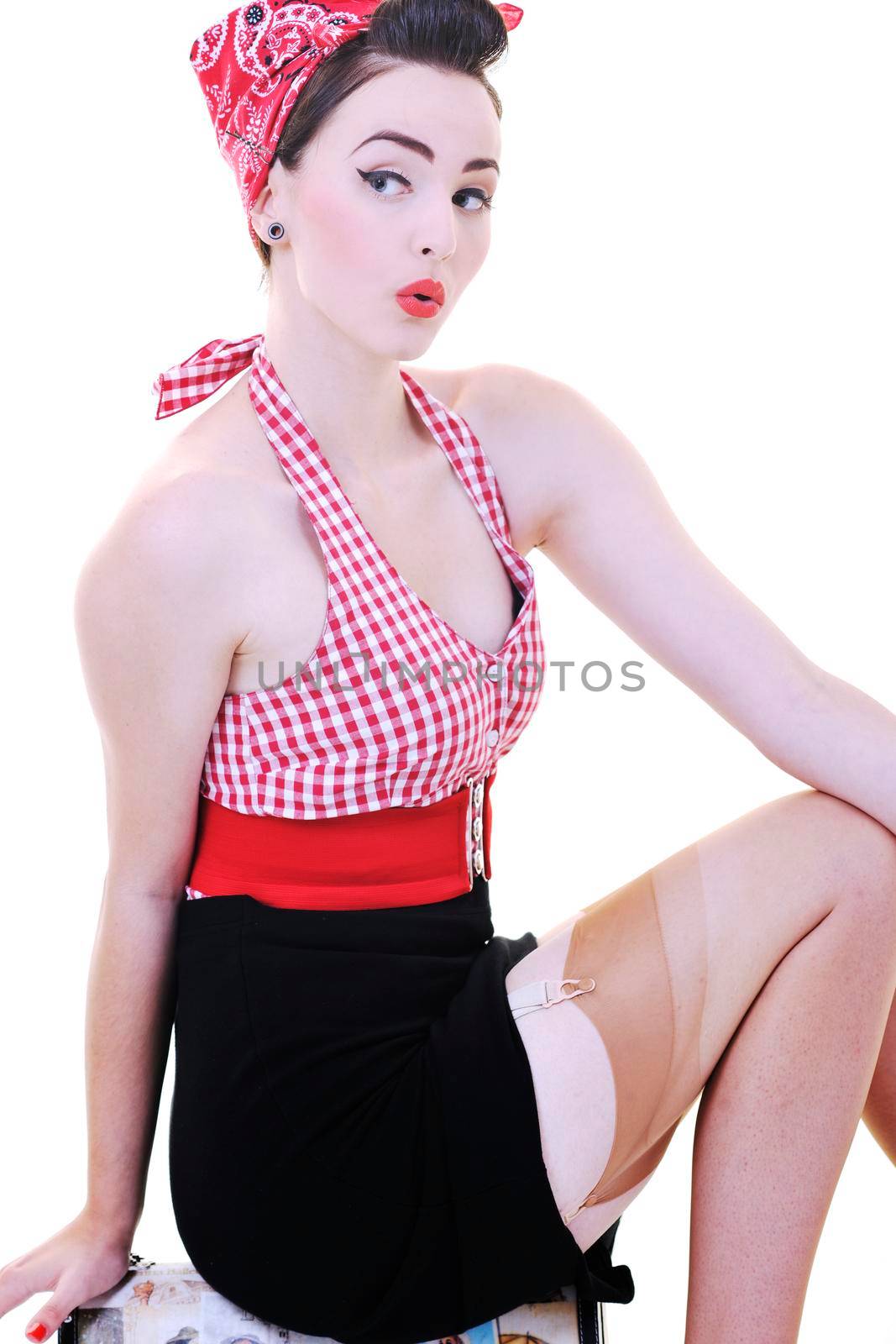 pretty young happy woman with travel bag waiting and posing isolated on white in studio