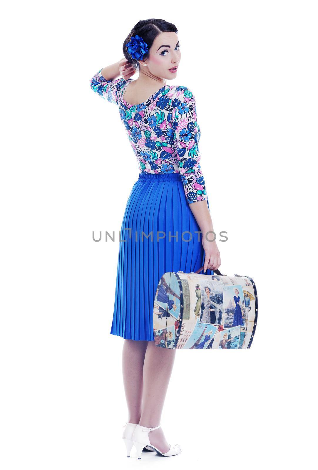 pretty young happy woman with travel bag waiting and posing isolated on white backround  in studio