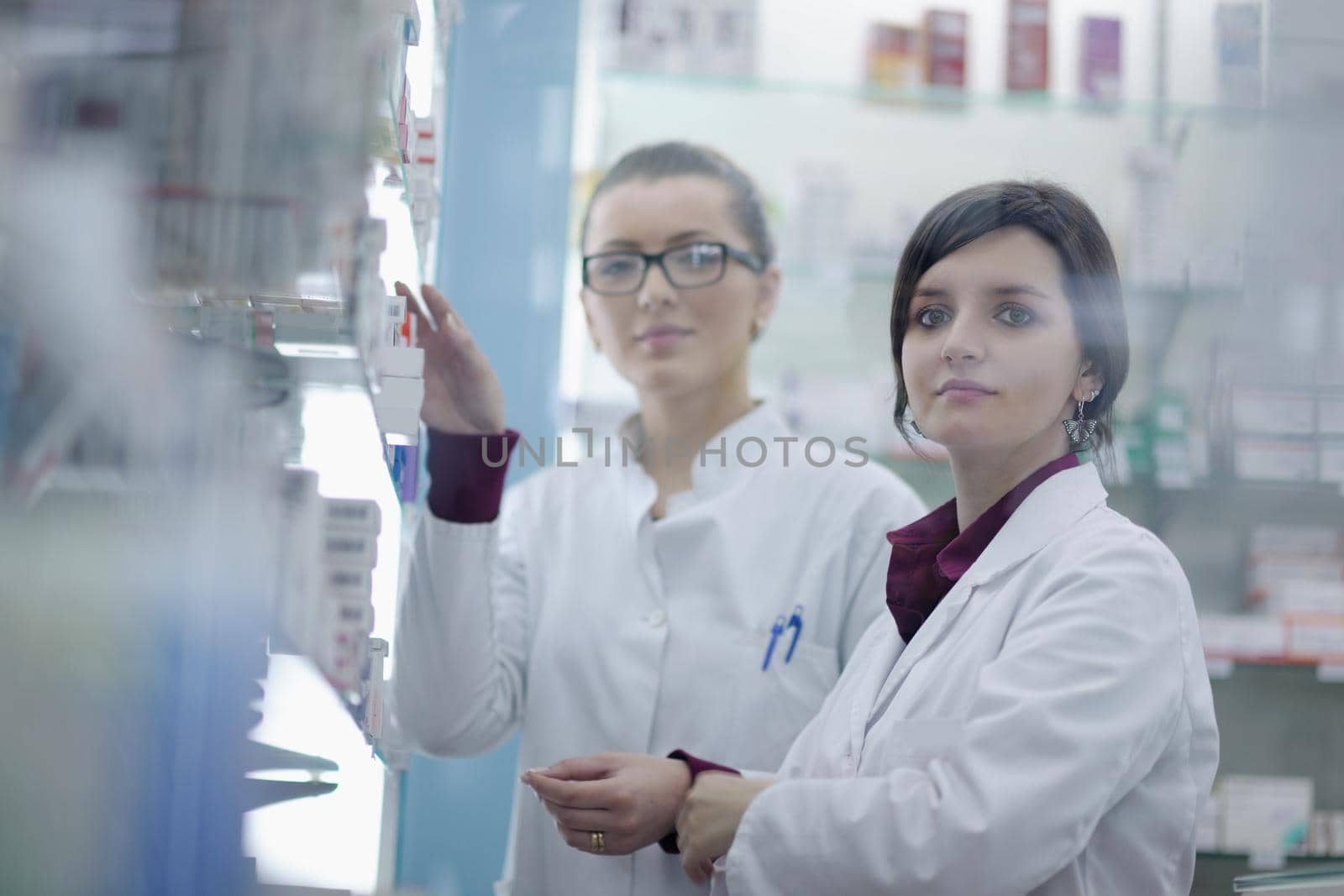 team of  pharmacist chemist woman group  standing in pharmacy drugstore