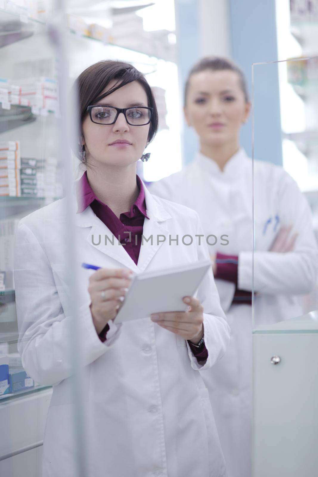 team of  pharmacist chemist woman group  standing in pharmacy drugstore