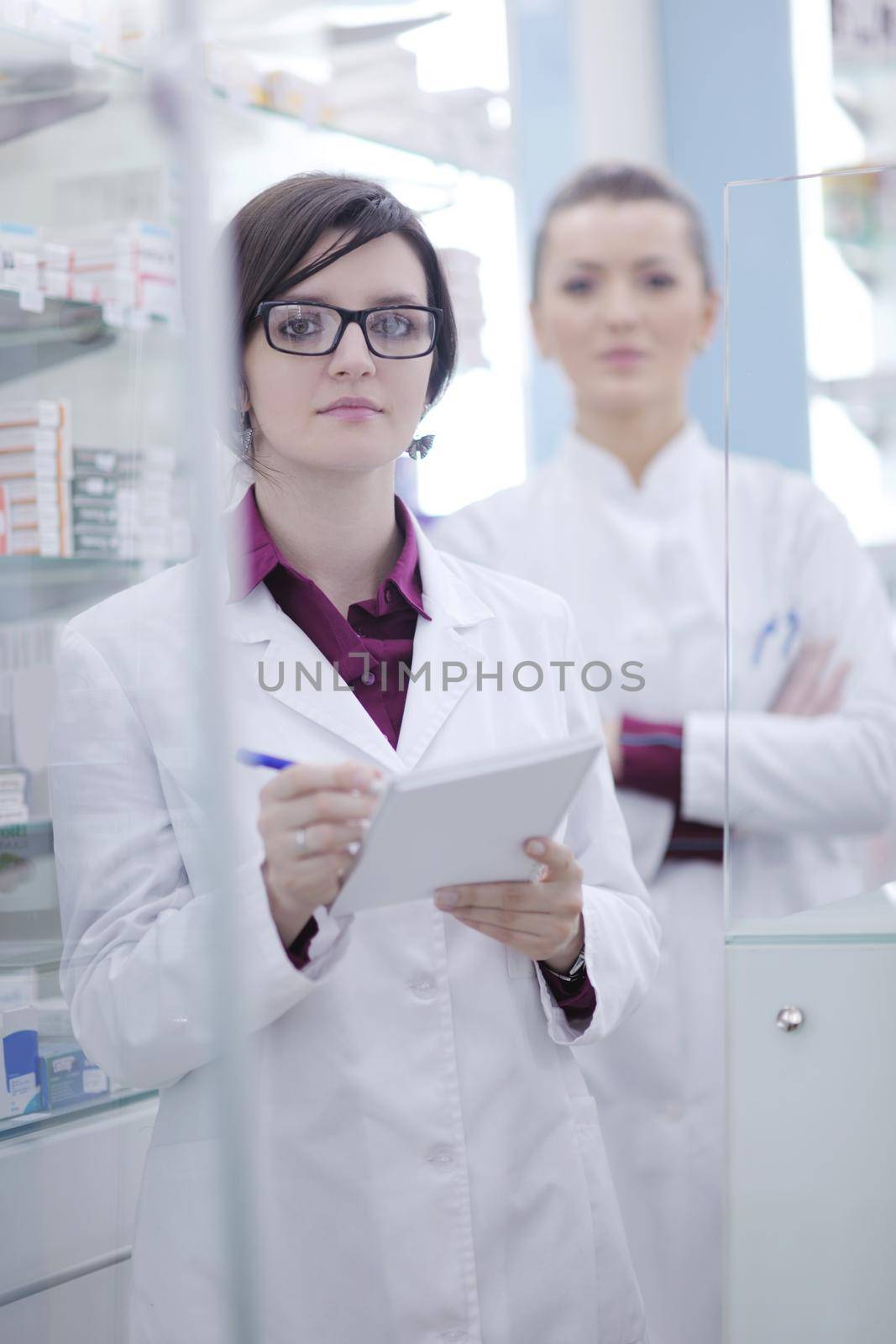 team of  pharmacist chemist woman group  standing in pharmacy drugstore