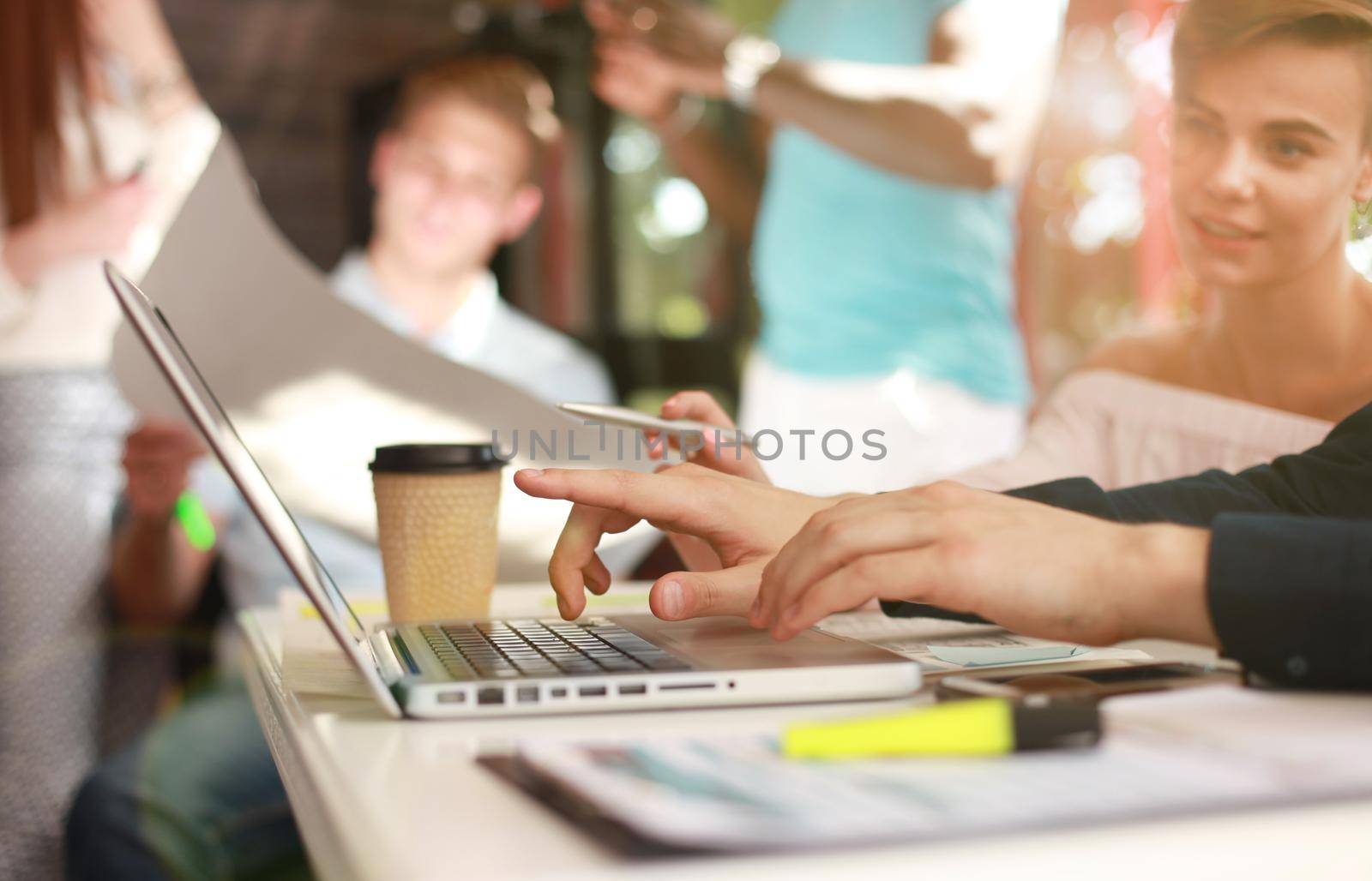 Young group of people doing their jobs on laptop.