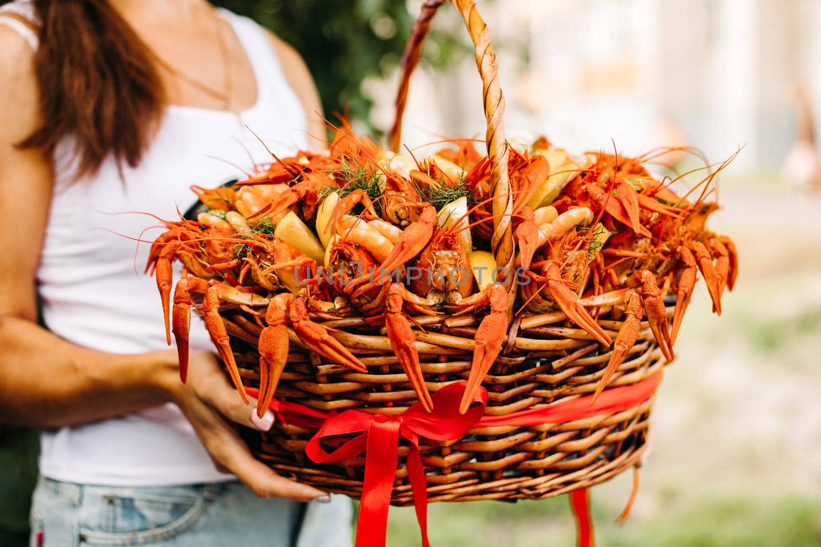 Large basket with cooked red large crayfish by StudioLucky