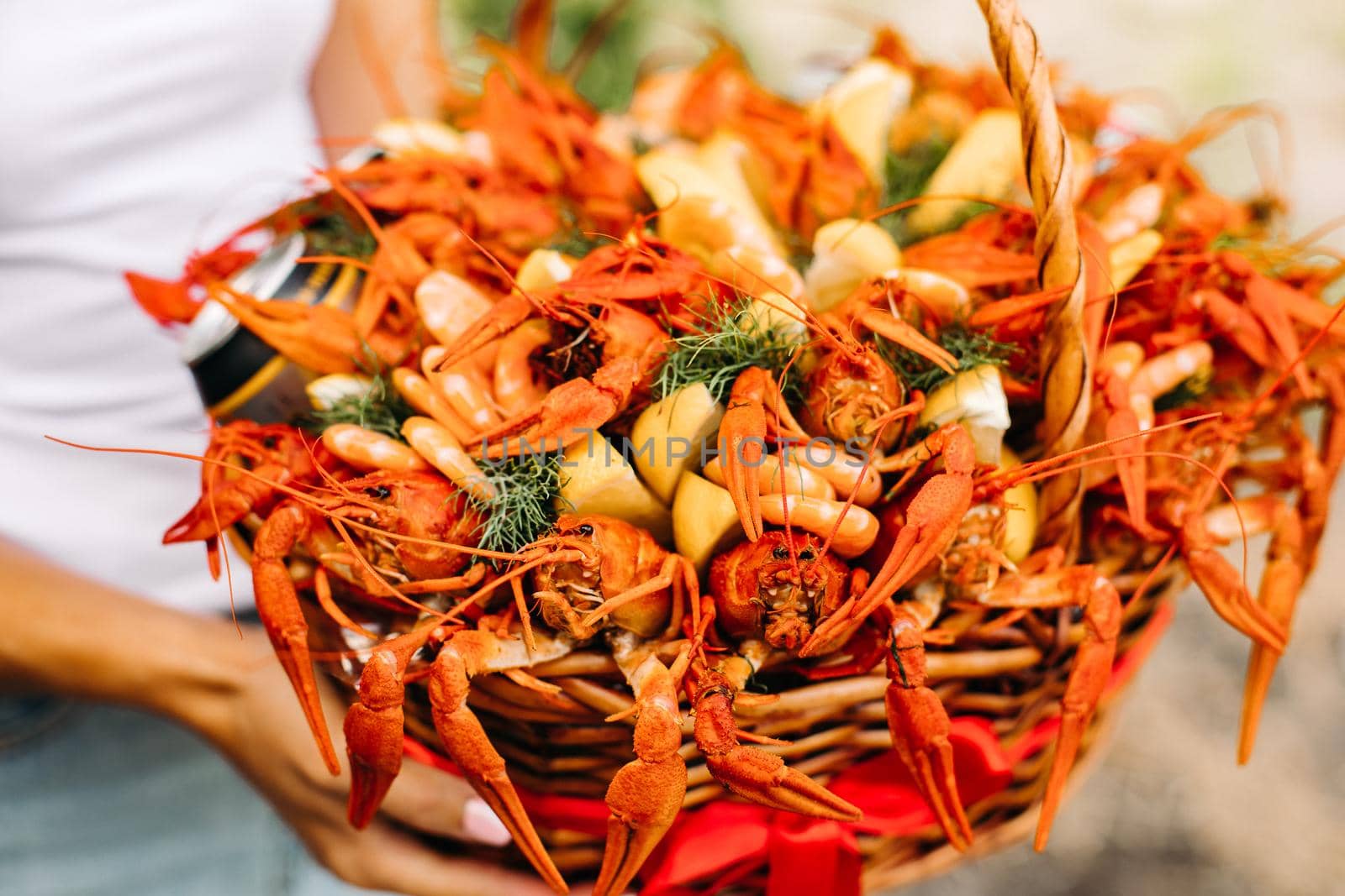 Festive woven gift basket for a man with crayfish and lemons