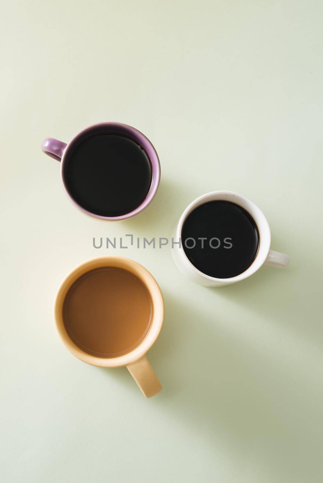 Cups of coffee on light background by makidotvn