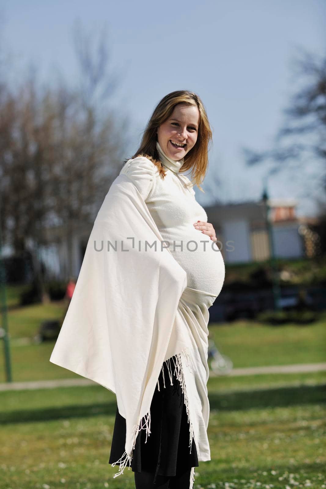 happy young pregnant womant have fun outdoor in nature at sunny day