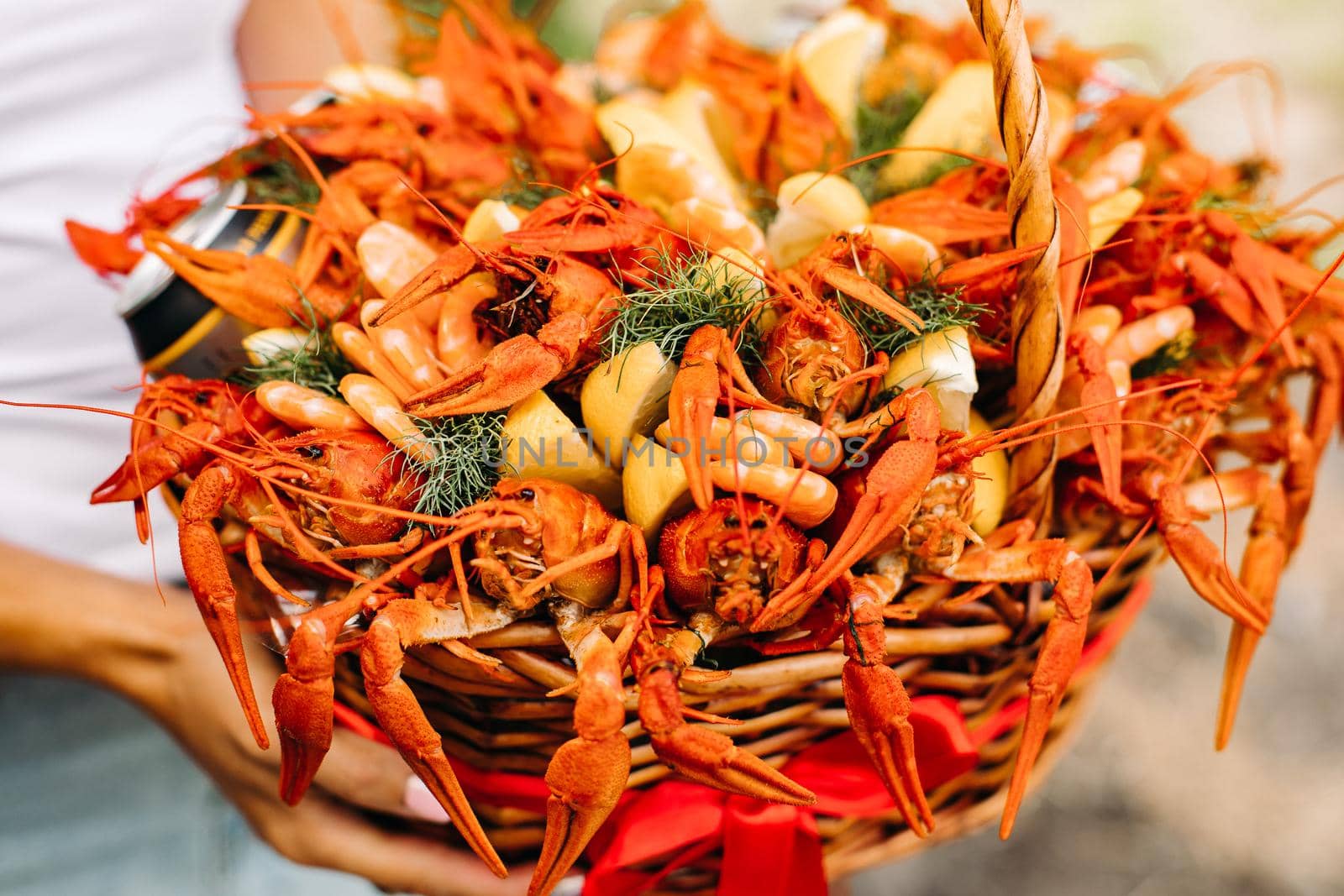 Festive woven gift basket for a man with crayfish and lemons