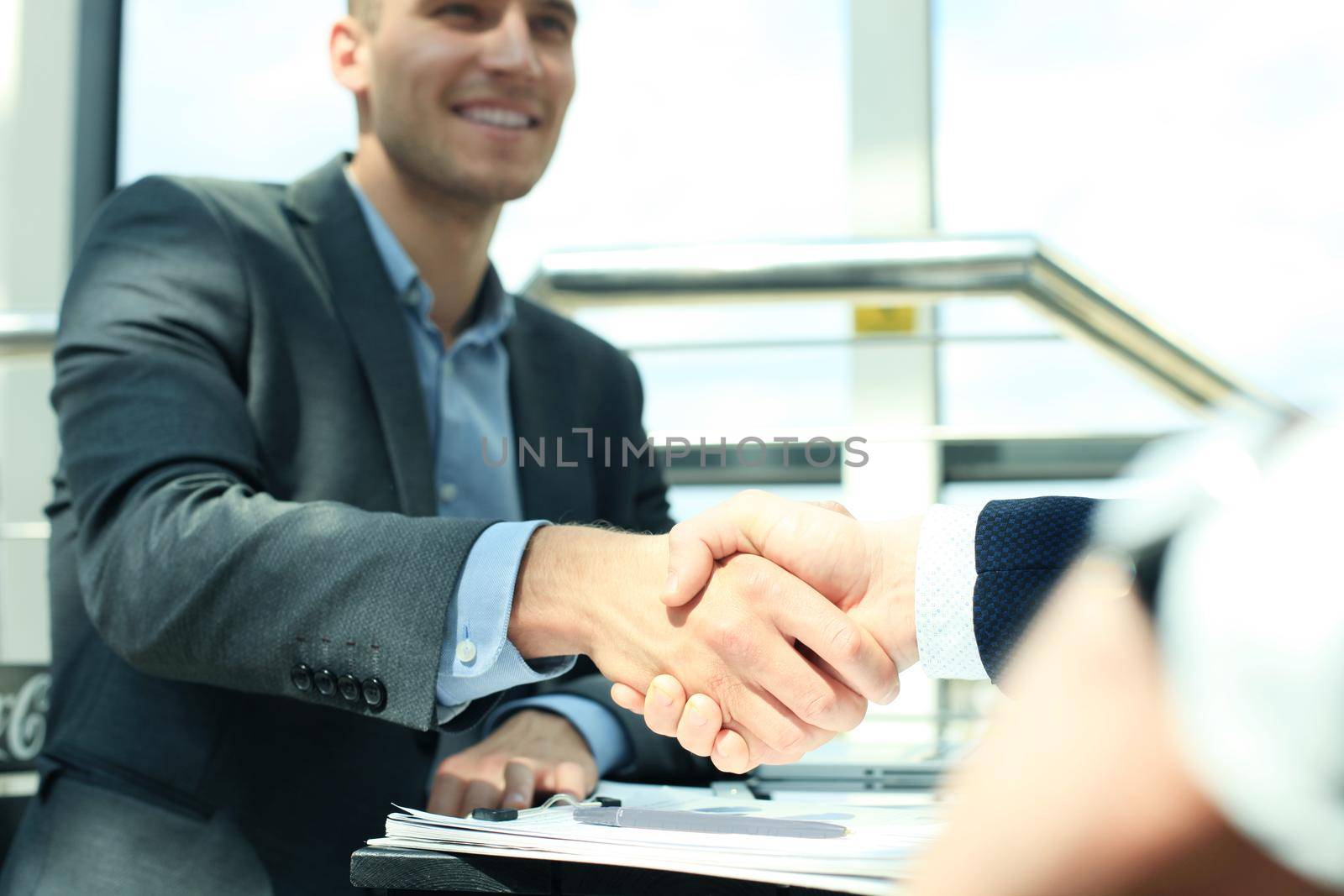 Business people shaking hands, finishing up a meeting