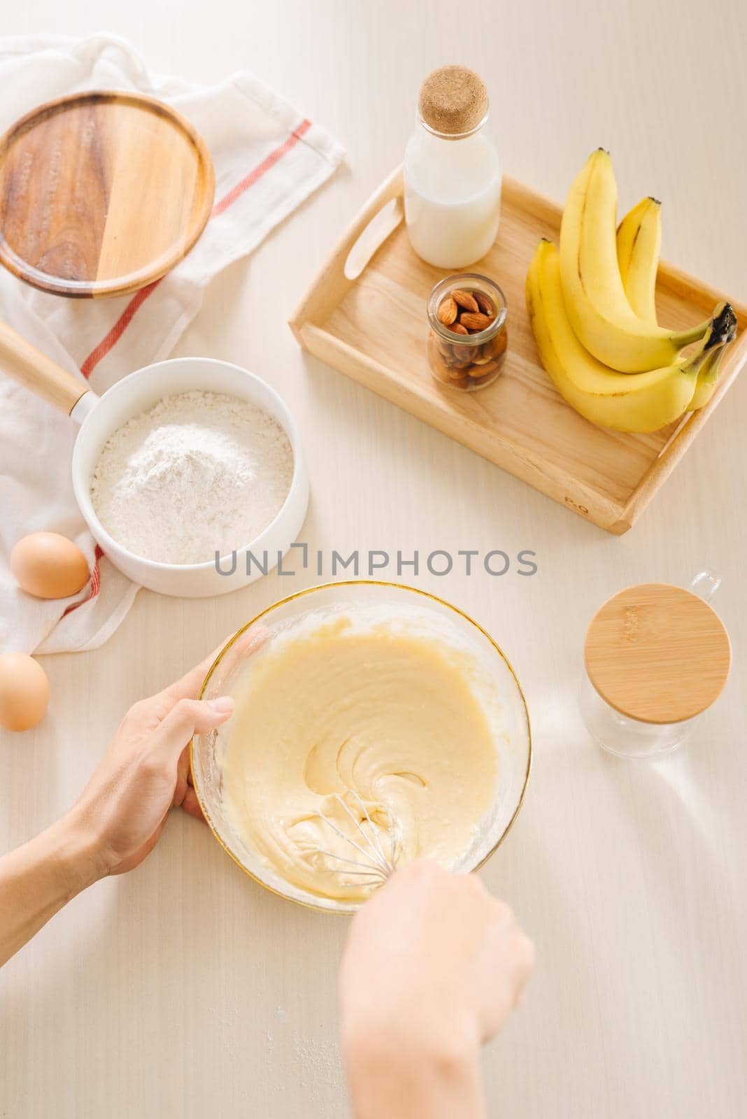 fresh eggs milk and flour on white table by makidotvn