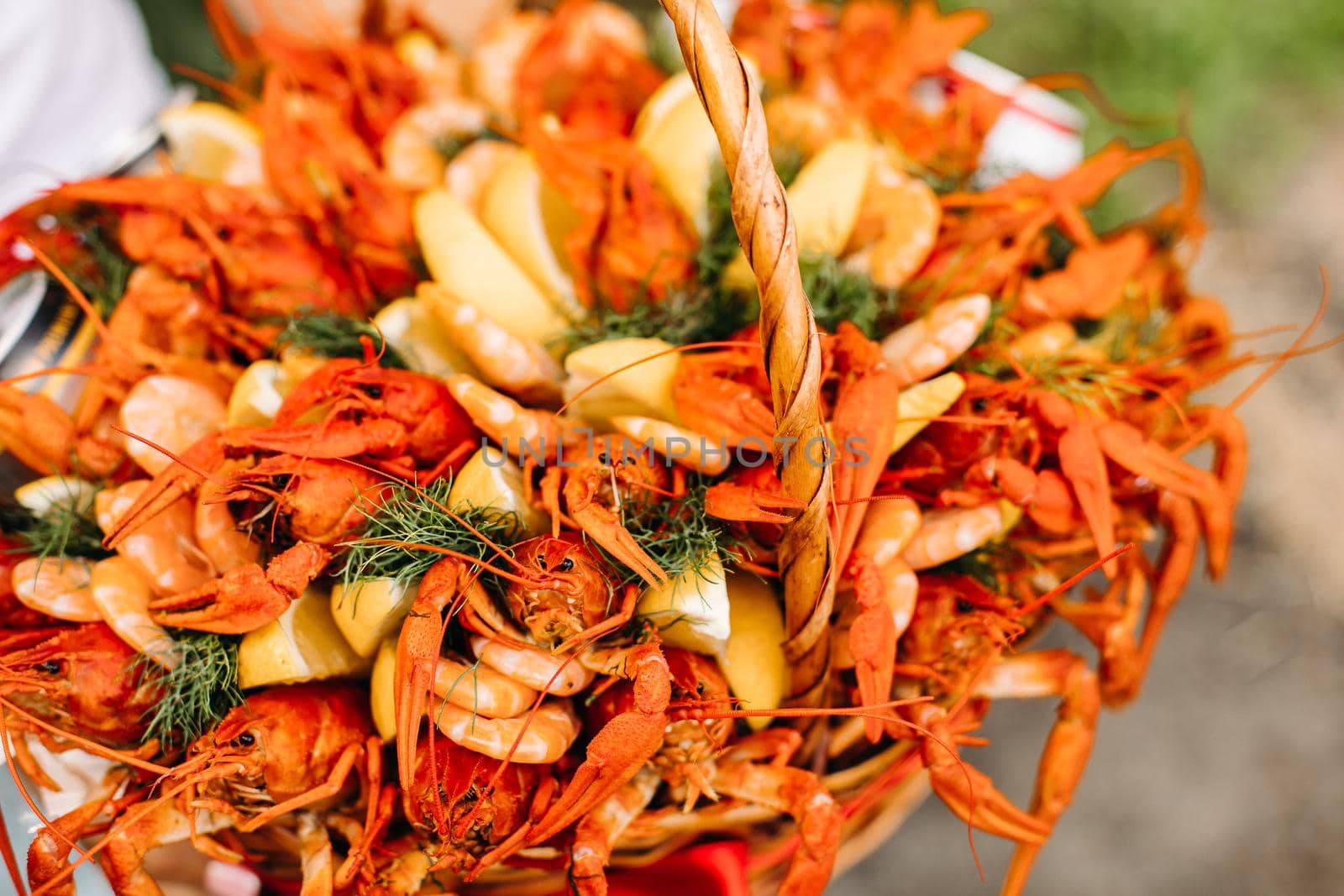 Festive woven gift basket for a man with crayfish and lemons